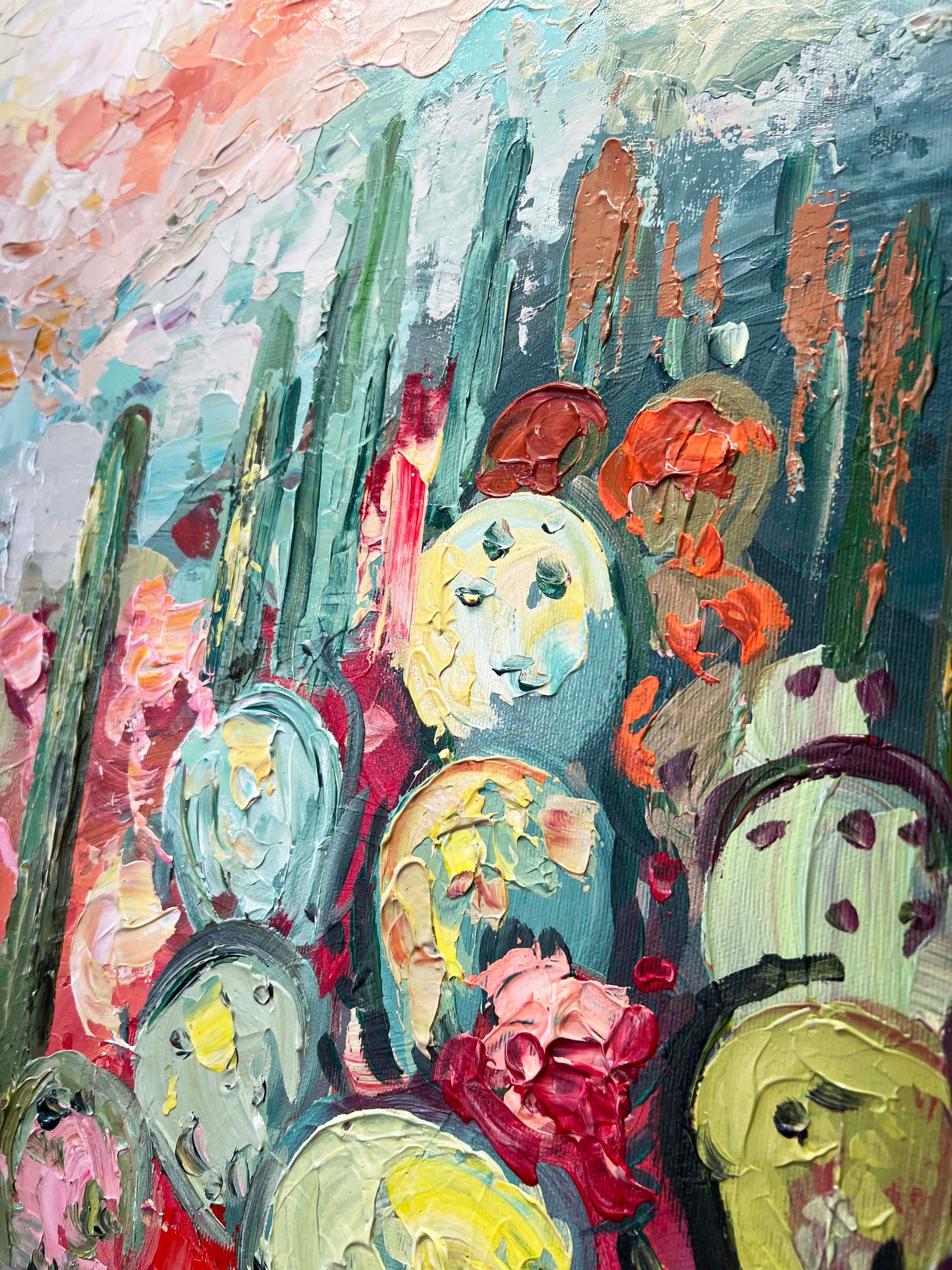 a painting of flowers and cacti on a canvas