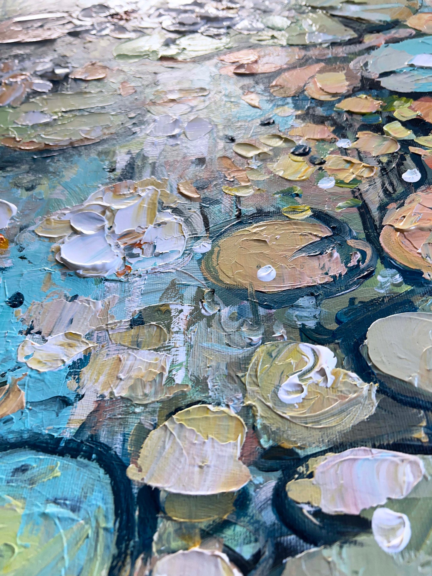 a close up of a painting of water lilies