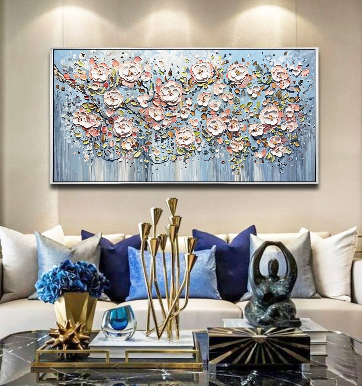 a living room filled with furniture and a painting on the wall