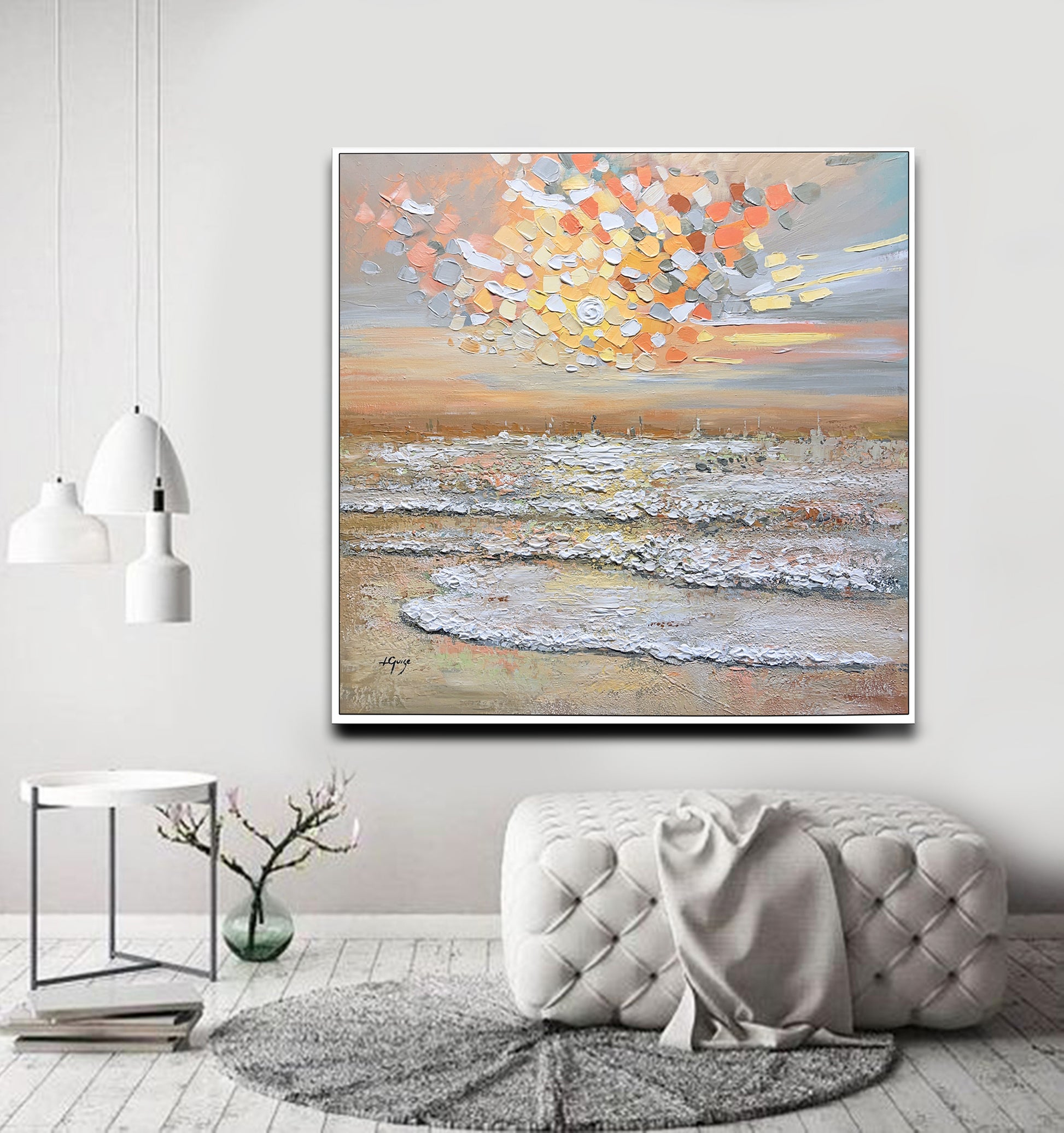 a living room with a couch and a painting on the wall