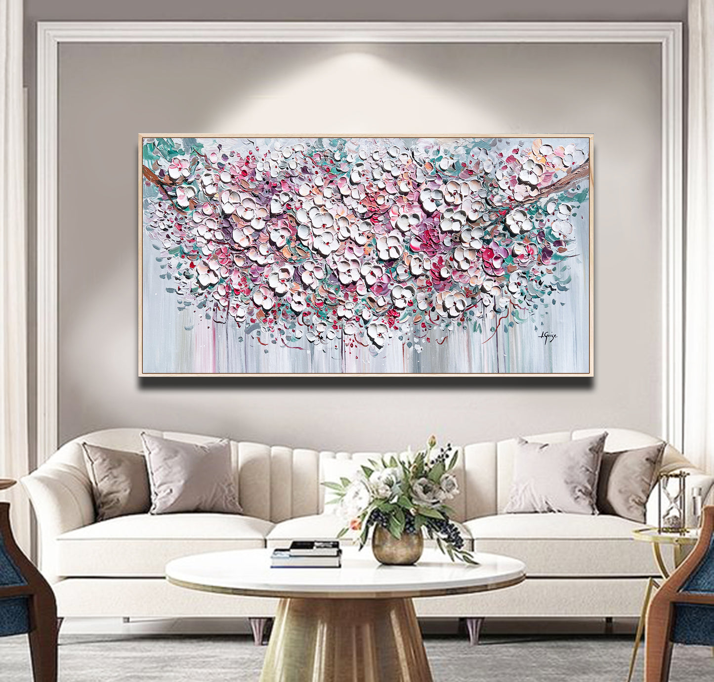 a living room filled with furniture and a painting on the wall