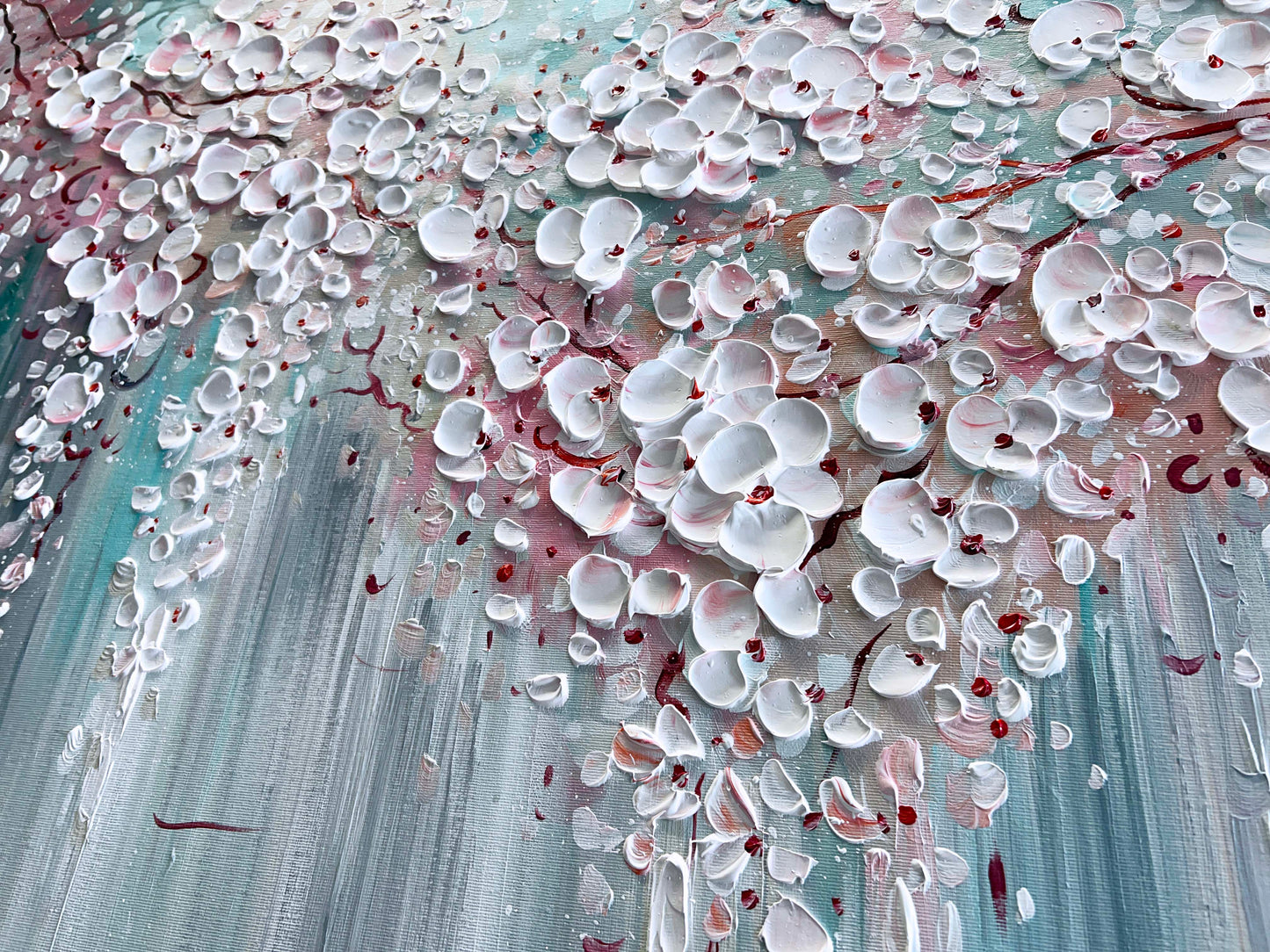 a painting of white flowers on a blue background