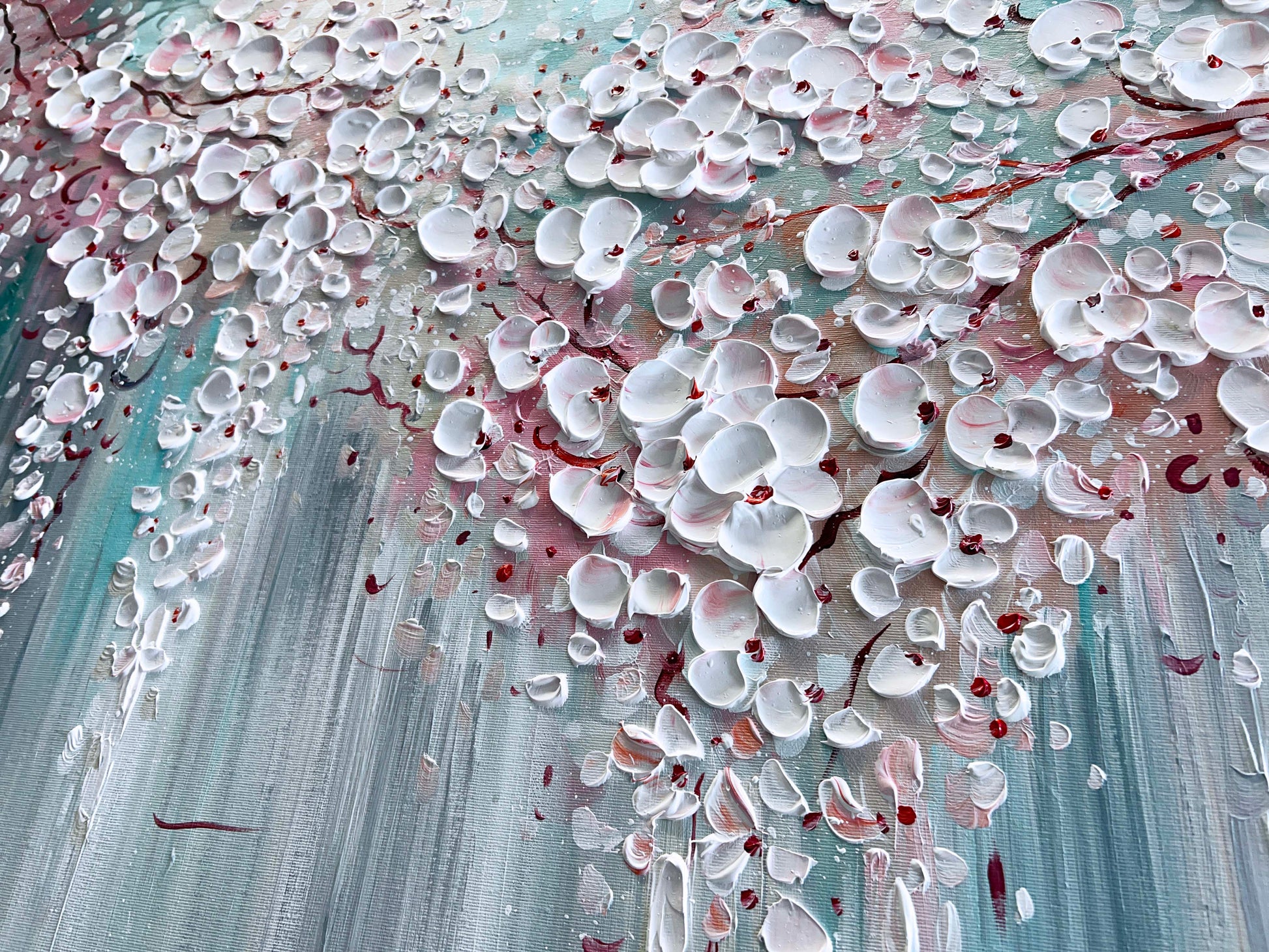 a painting of white flowers on a blue background