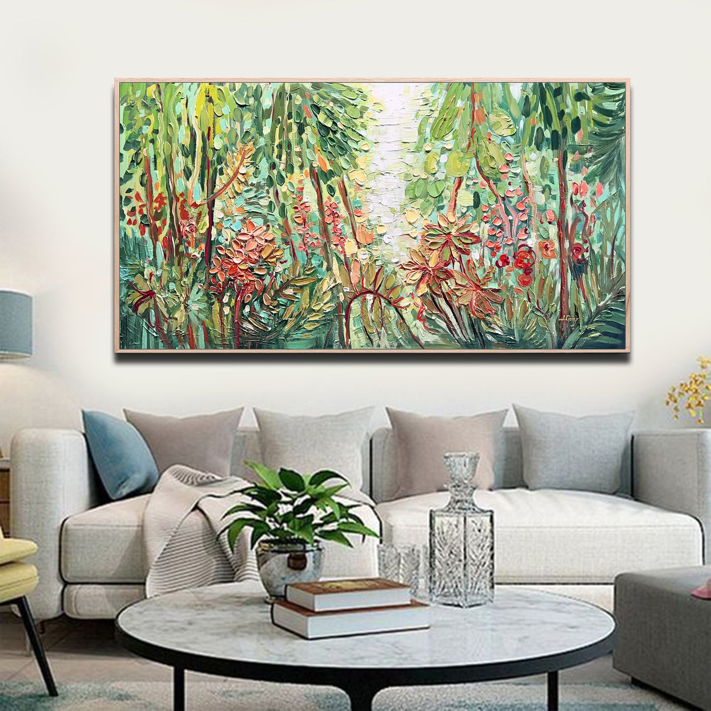 a living room filled with furniture and a painting on the wall