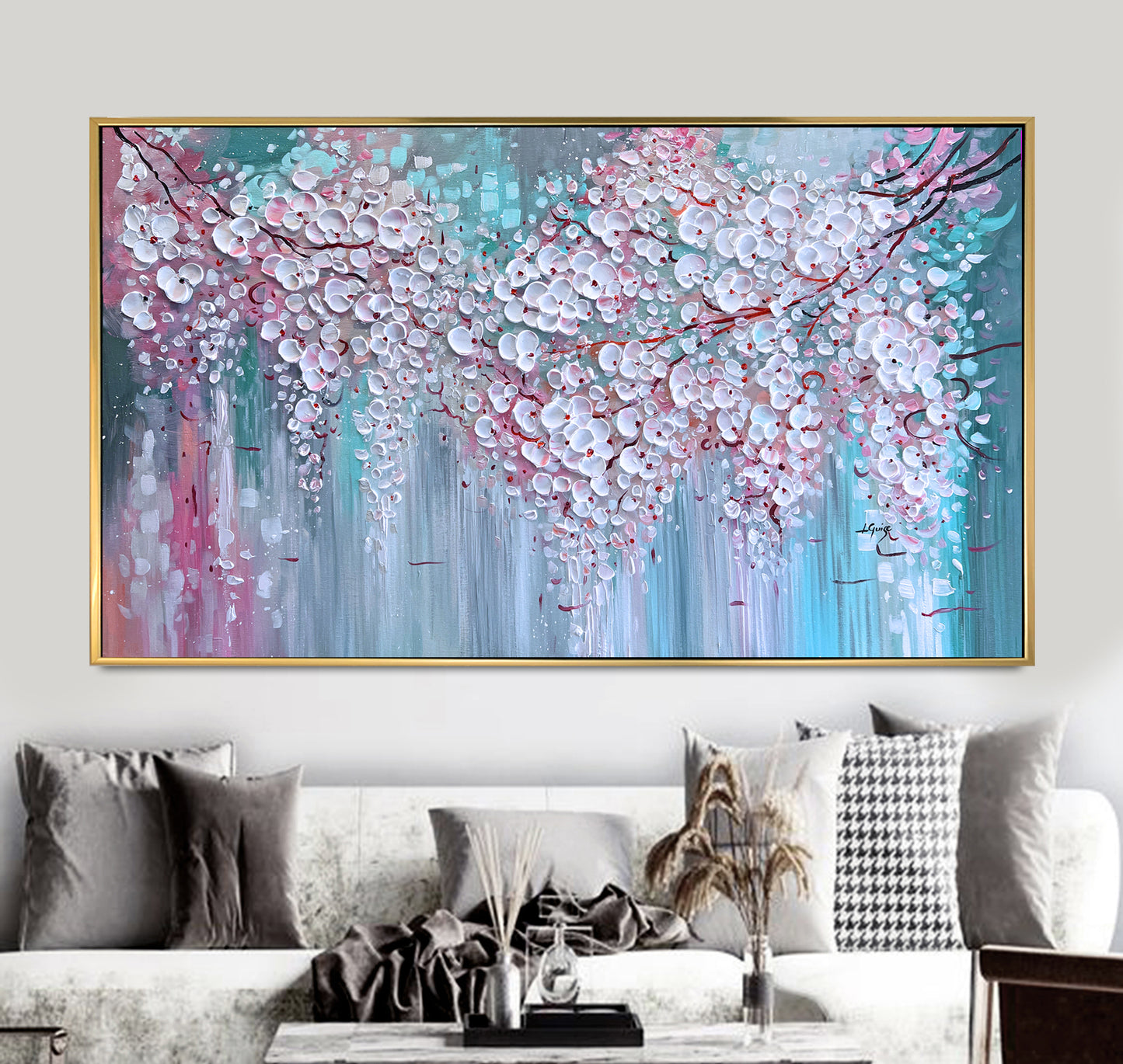 a living room with a couch and a painting on the wall