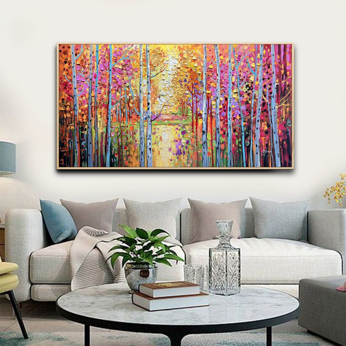 a living room filled with furniture and a painting on the wall