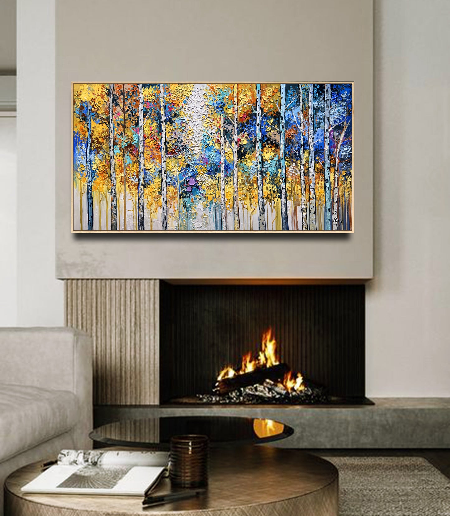 a living room with a fire place and a painting on the wall