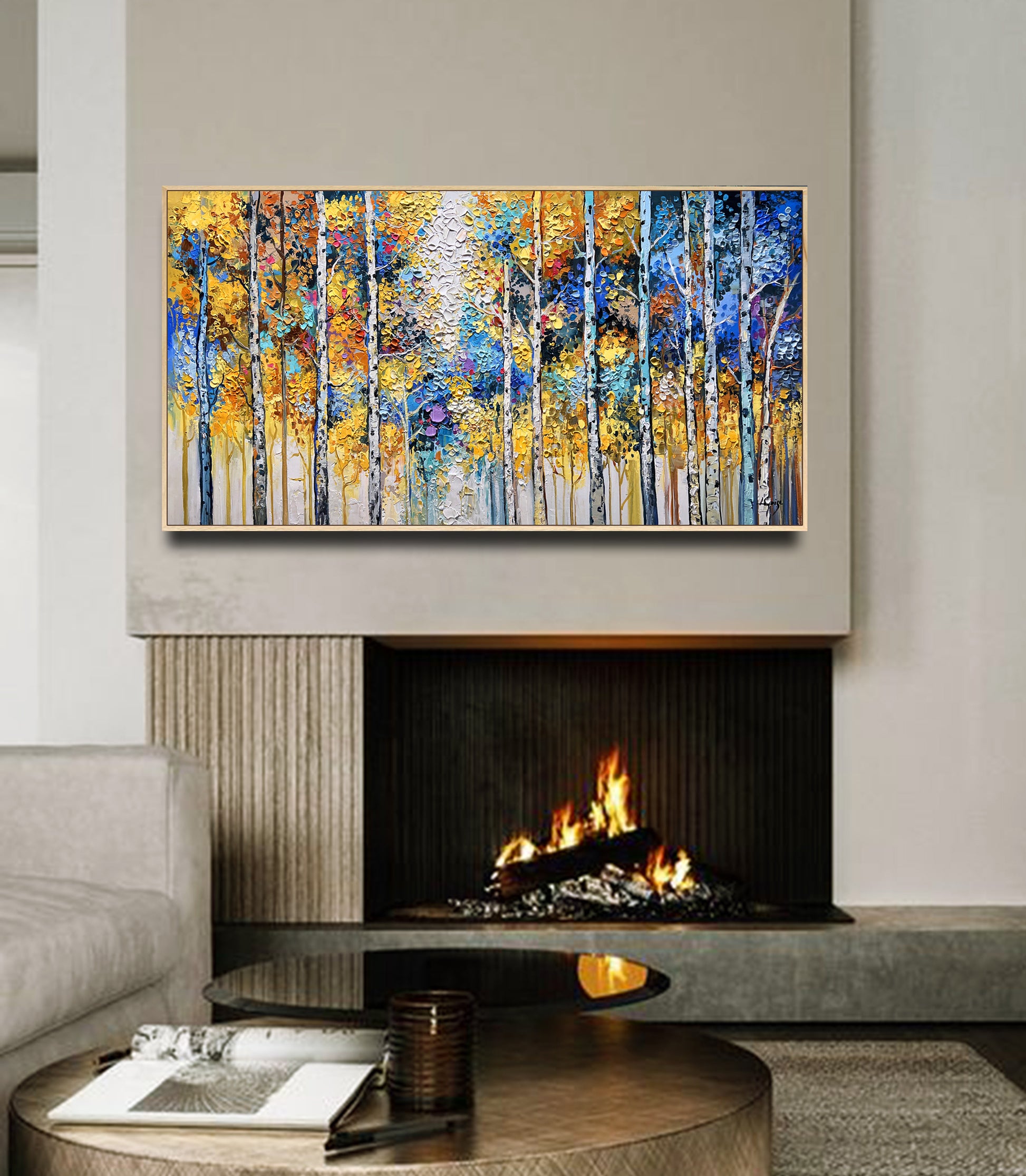 a living room with a fire place and a painting on the wall