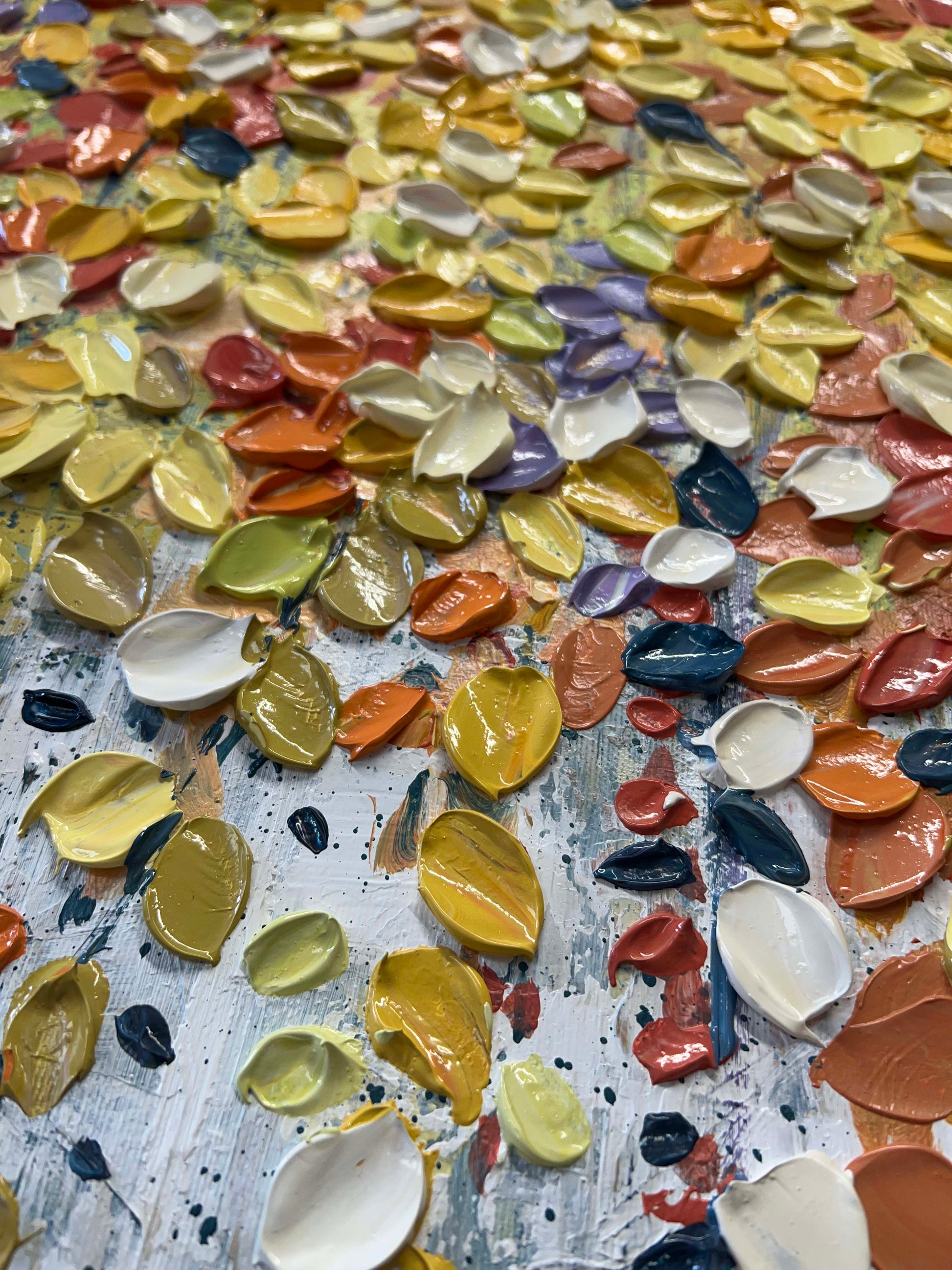 a close up of a table with many different colors of paint