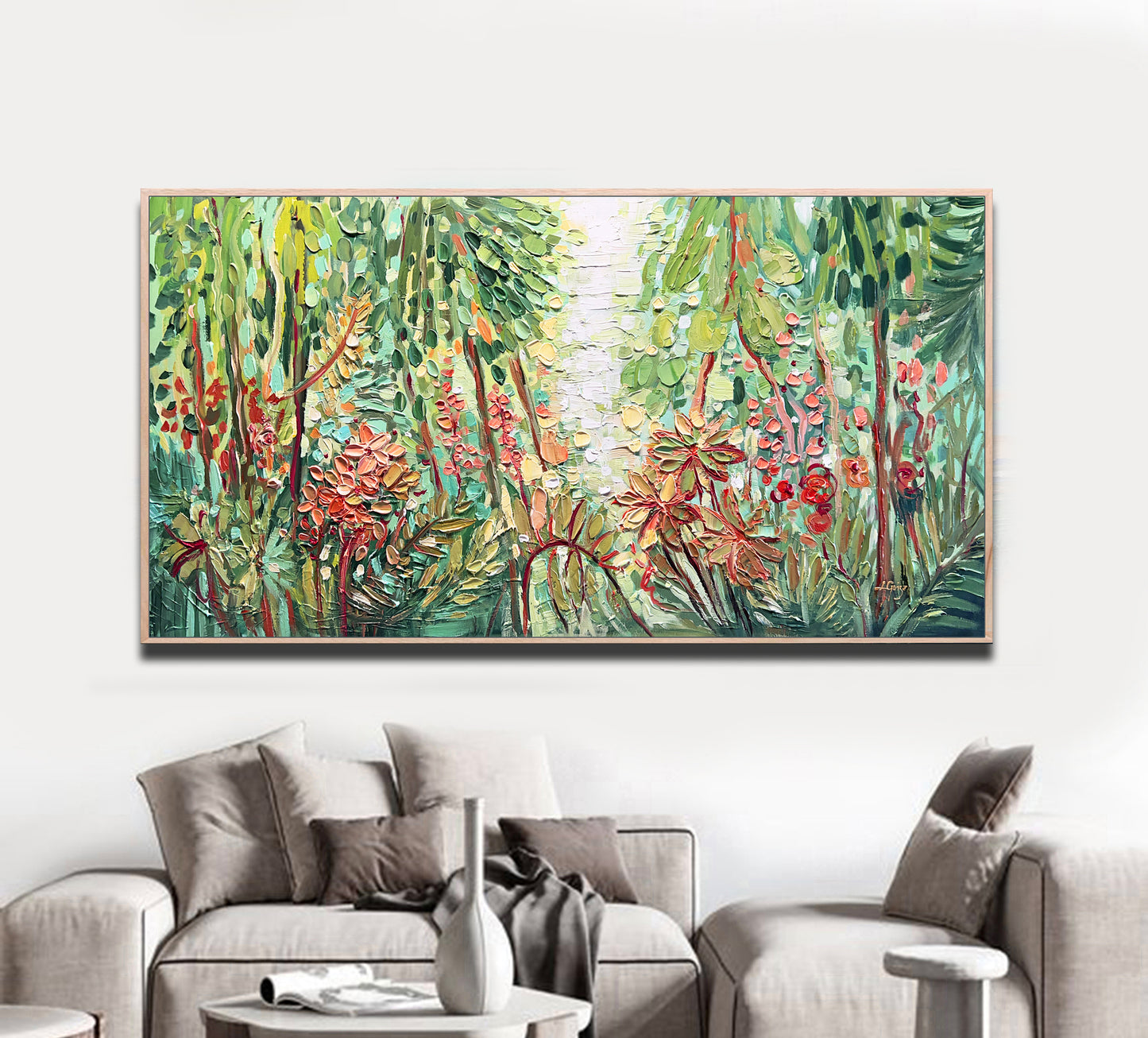 a living room with a couch and a painting on the wall