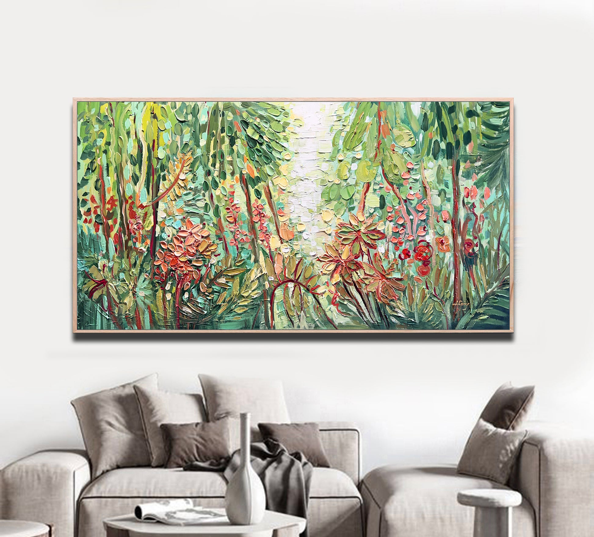 a living room with a couch and a painting on the wall