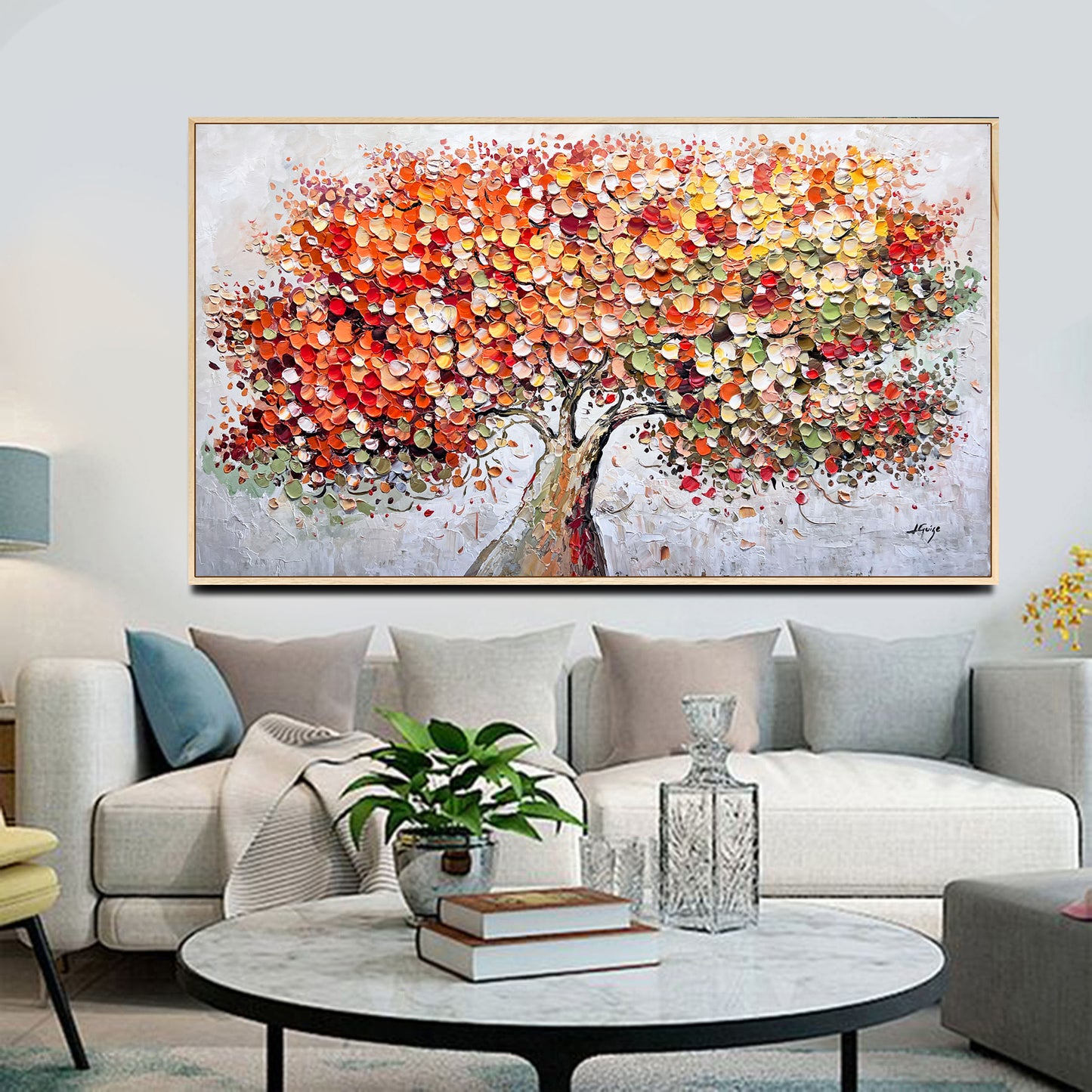 a living room filled with furniture and a painting on the wall