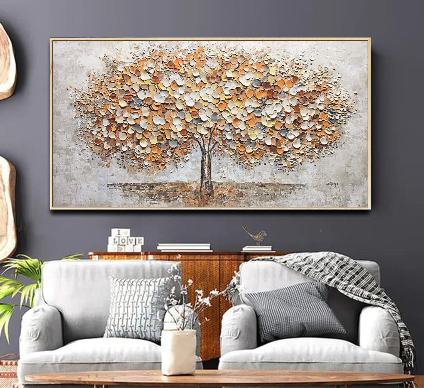 a living room with a couch and a painting on the wall