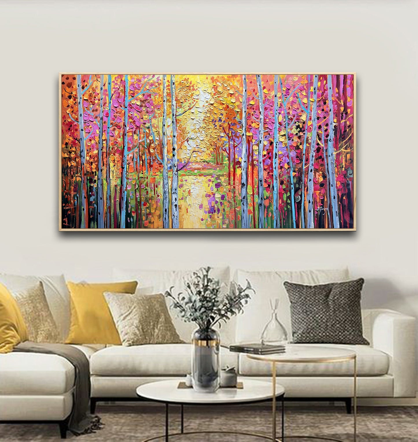 a living room with a couch and a painting on the wall