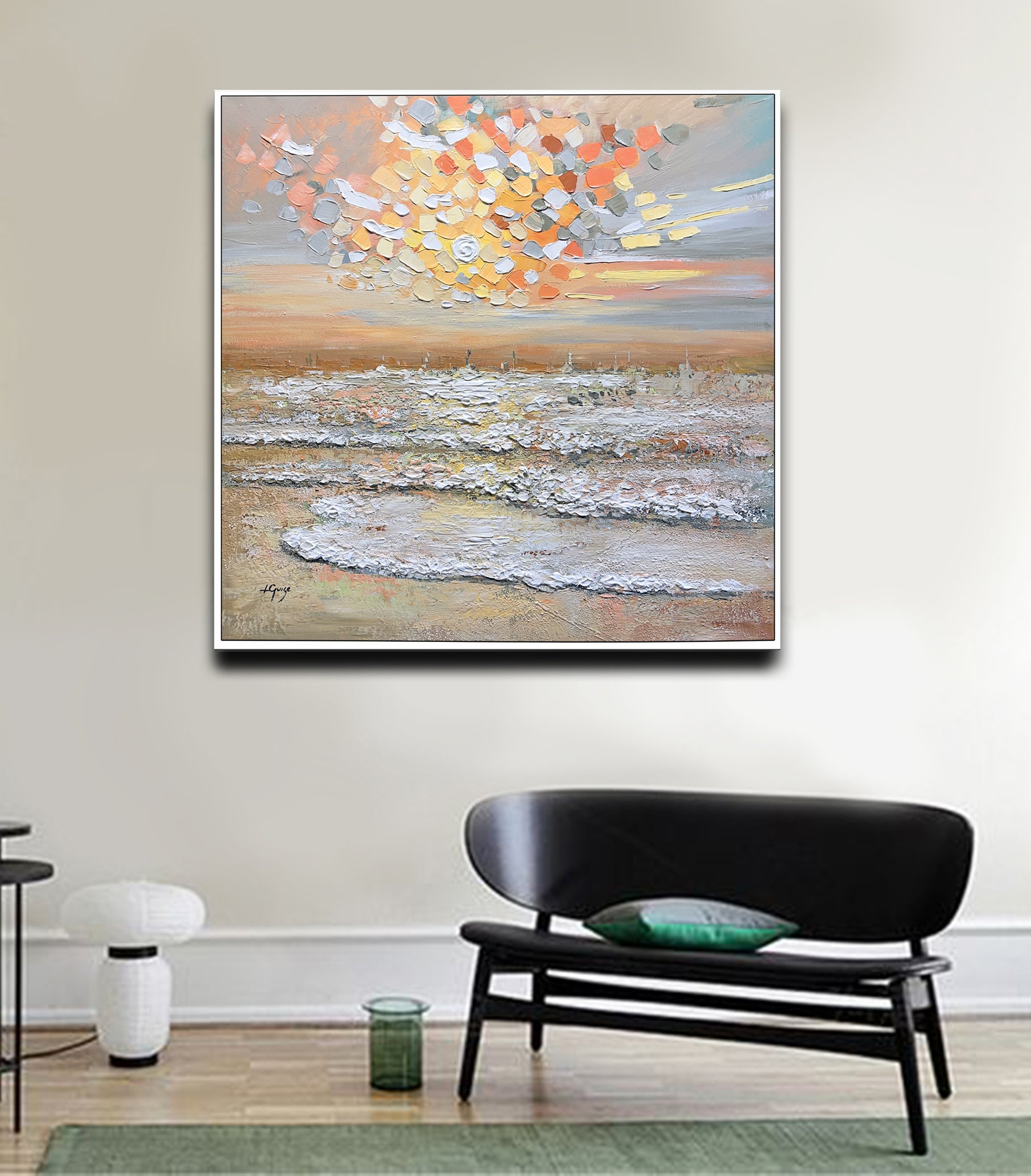 a living room with a couch and a painting on the wall