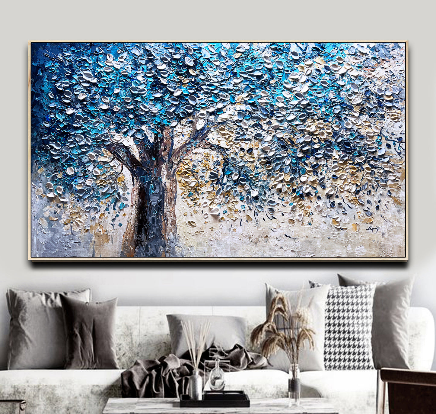 a living room with a couch and a painting on the wall