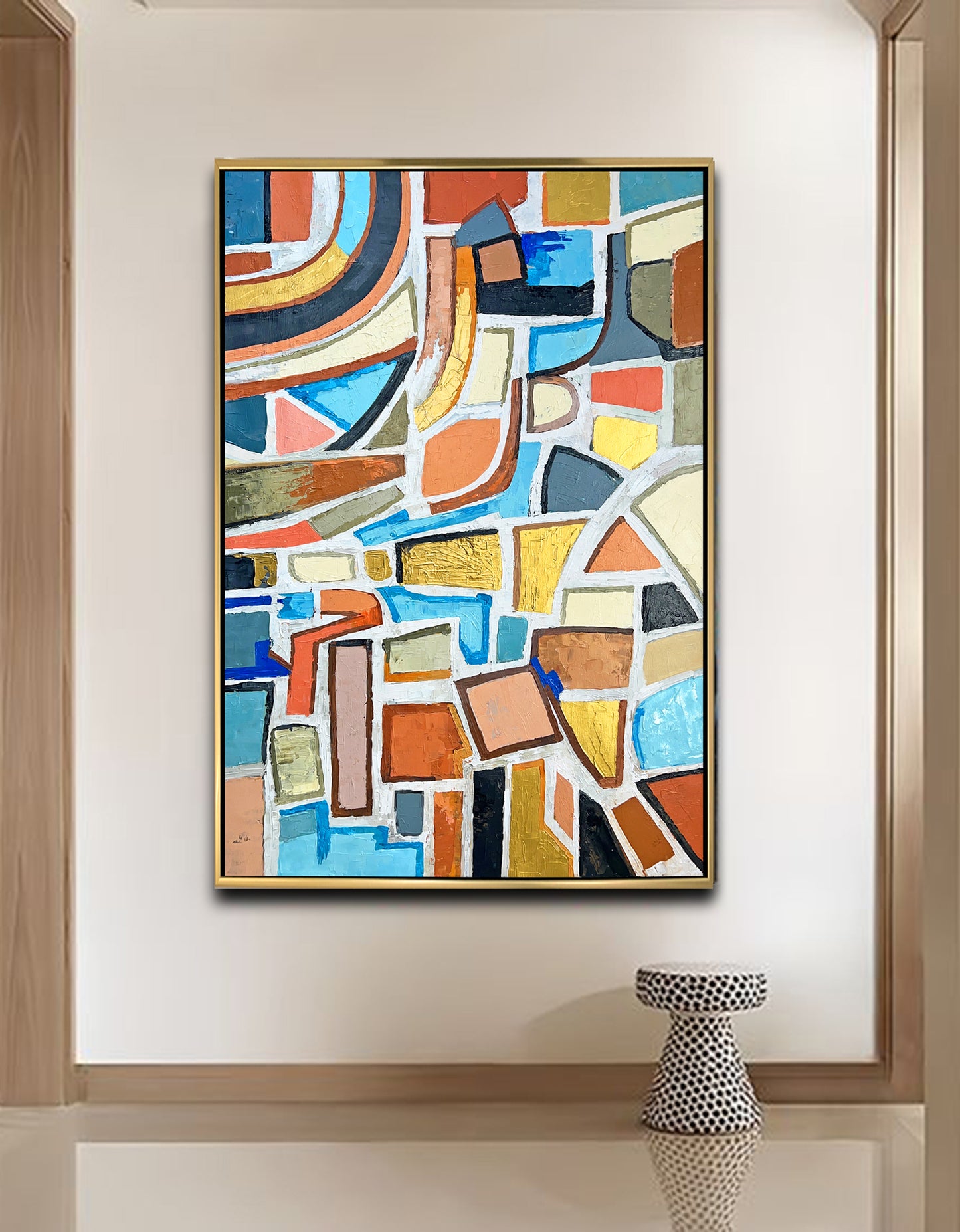 a painting hanging on a wall next to a vase