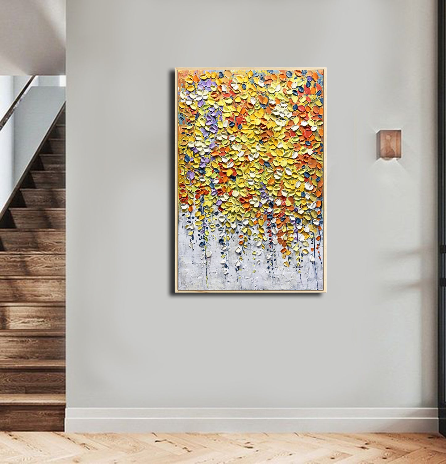 a painting hanging on a wall next to a stair case