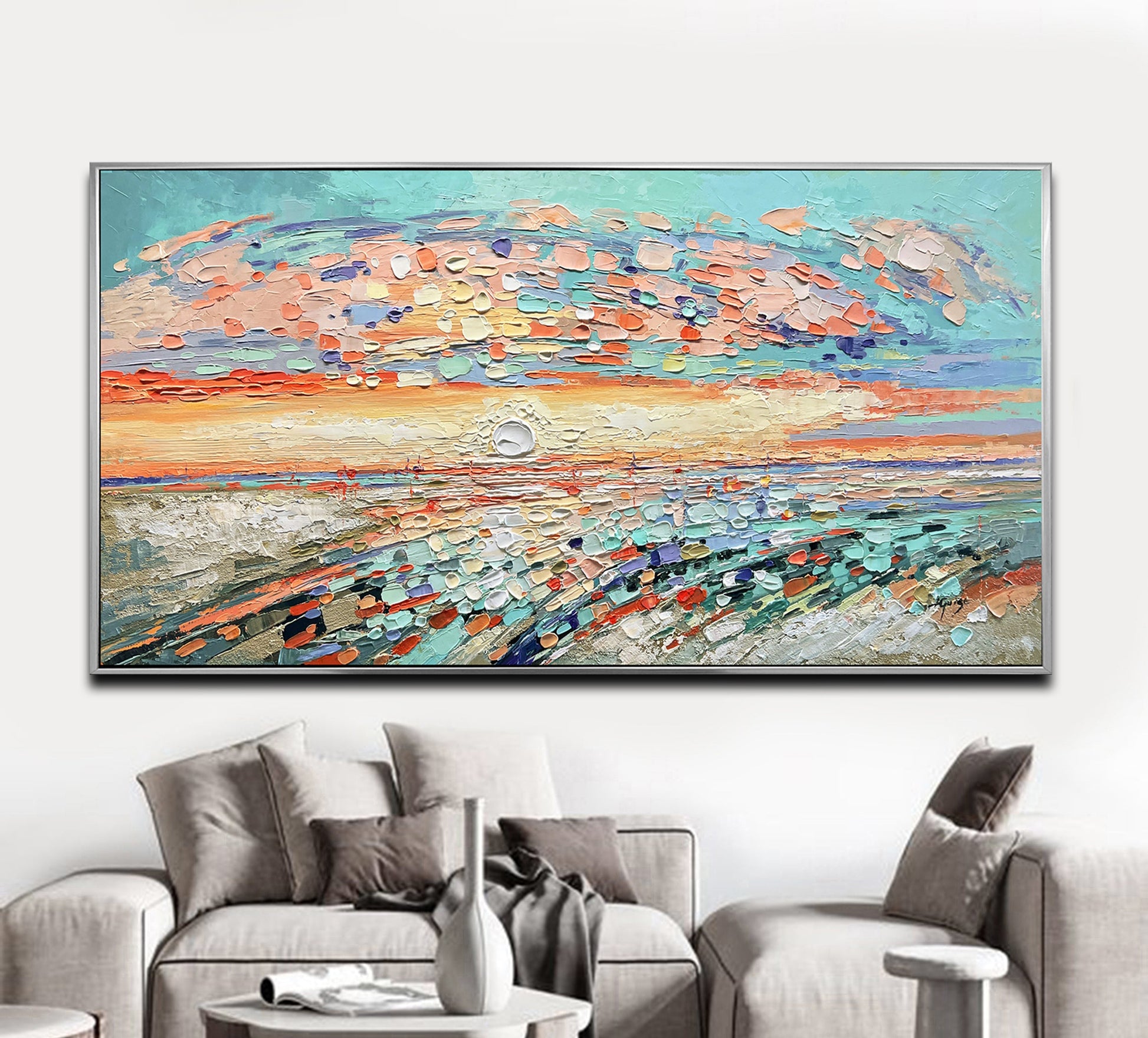 a living room with a couch and a painting on the wall