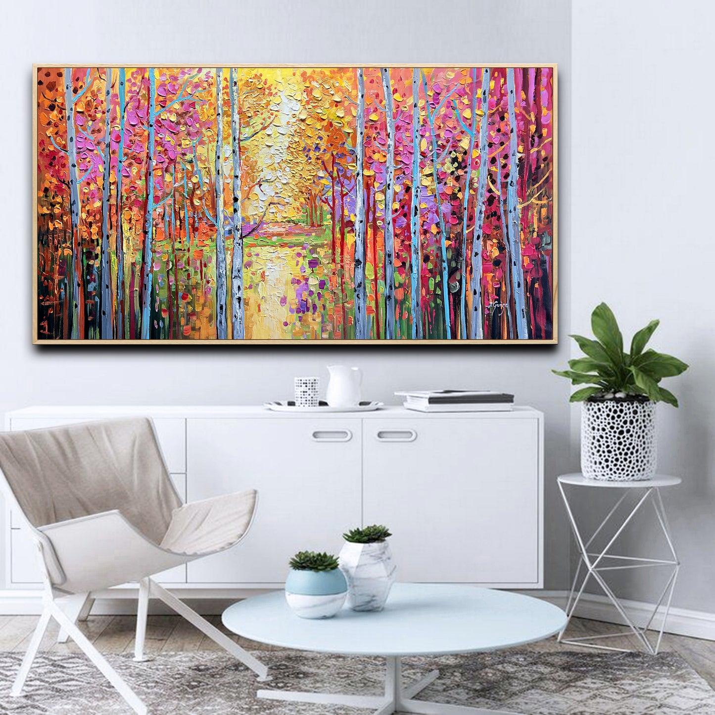 a living room with a painting on the wall