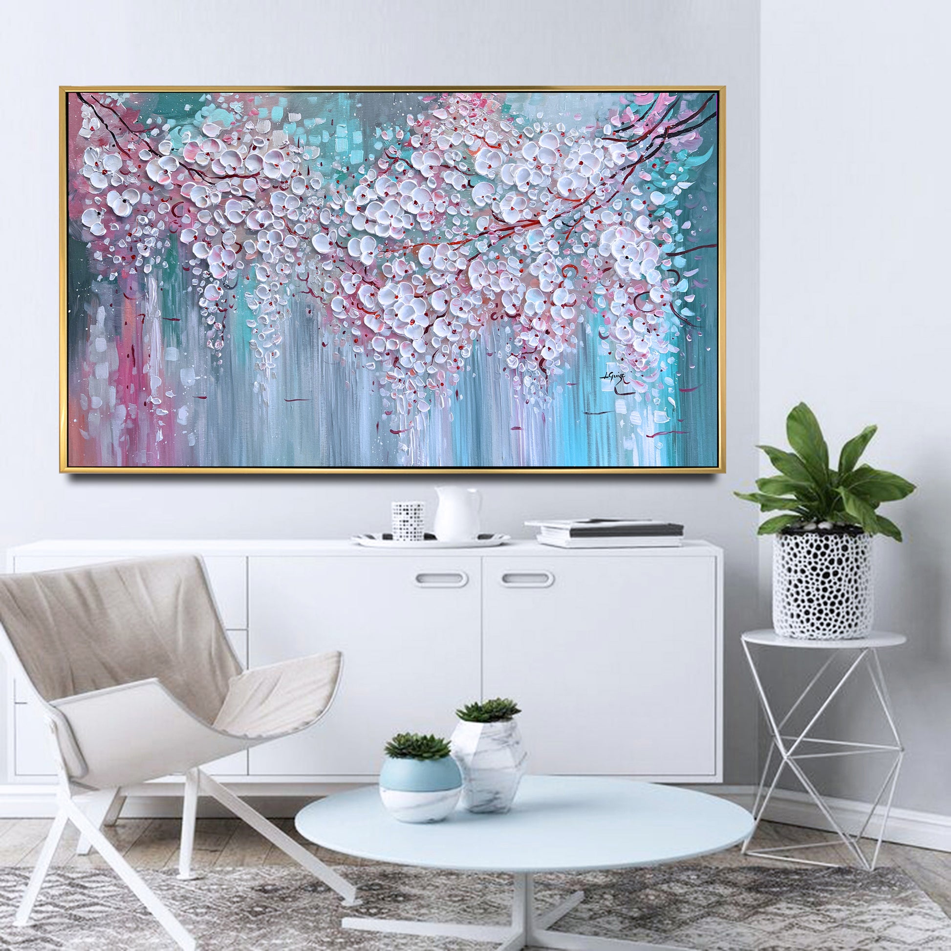 a living room with a painting on the wall