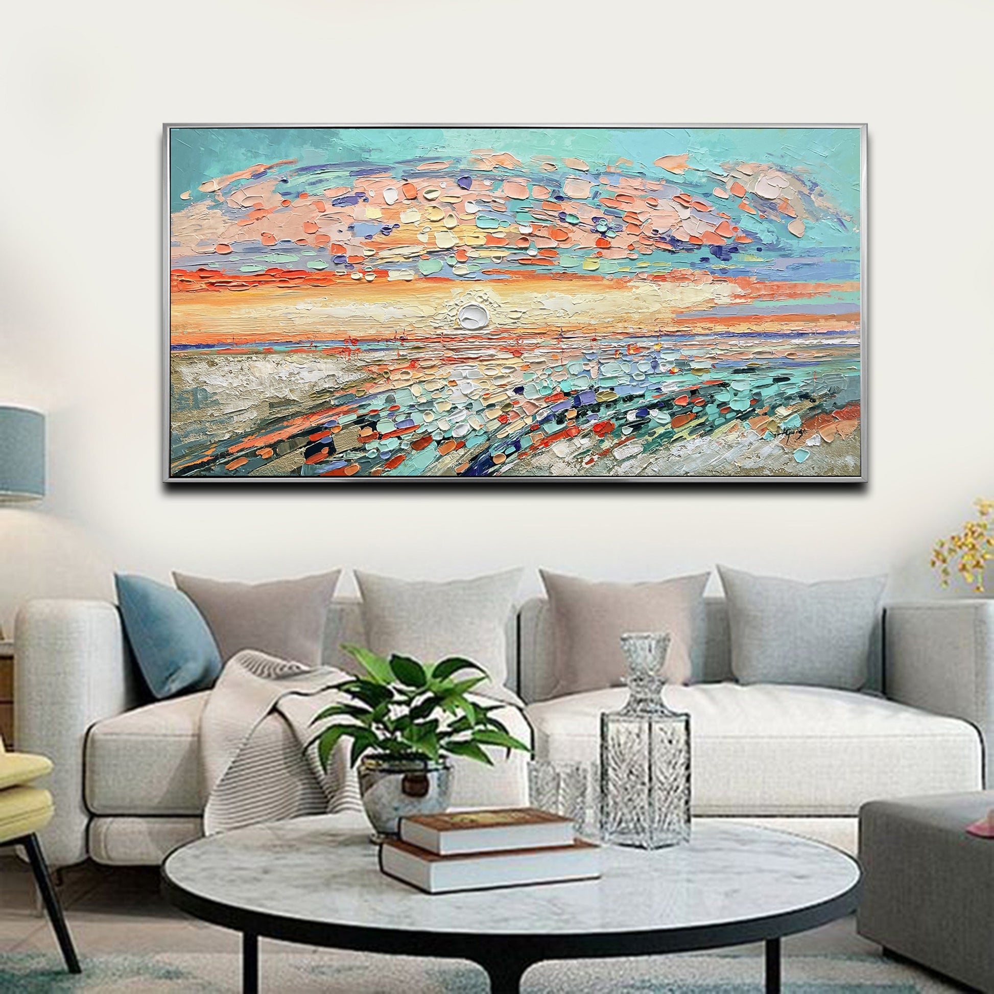 a living room filled with furniture and a painting on the wall