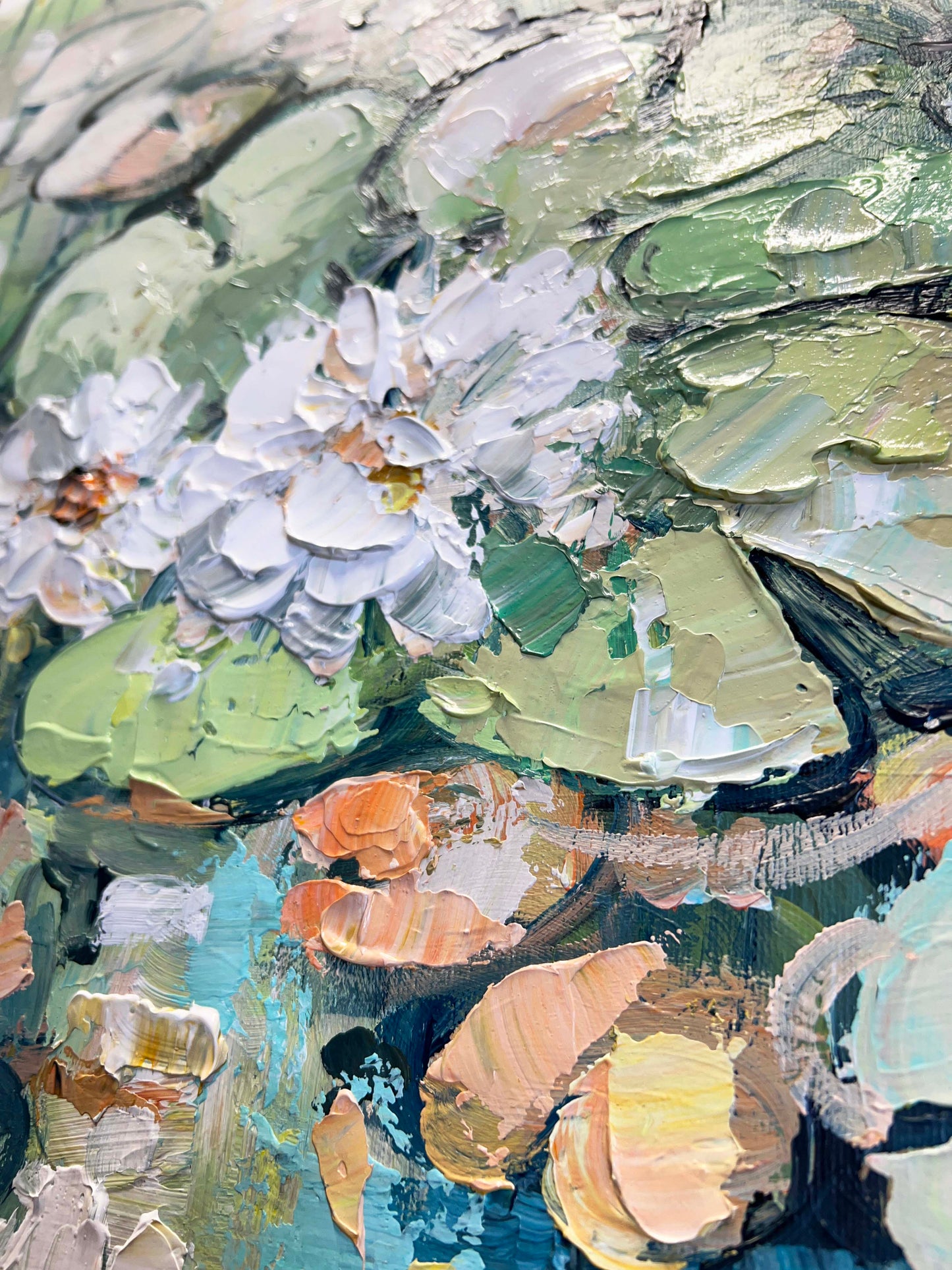 a close up of a painting of flowers and leaves