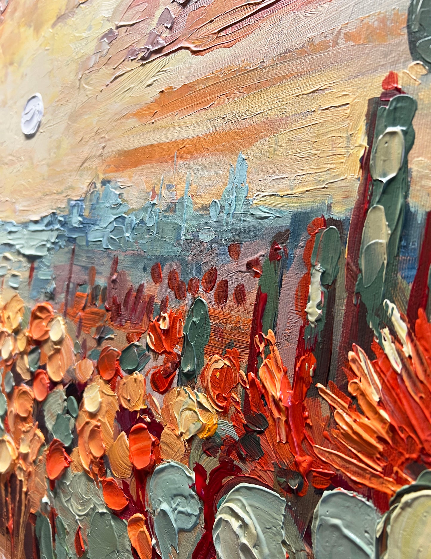 a painting of a desert scene with a sky in the background