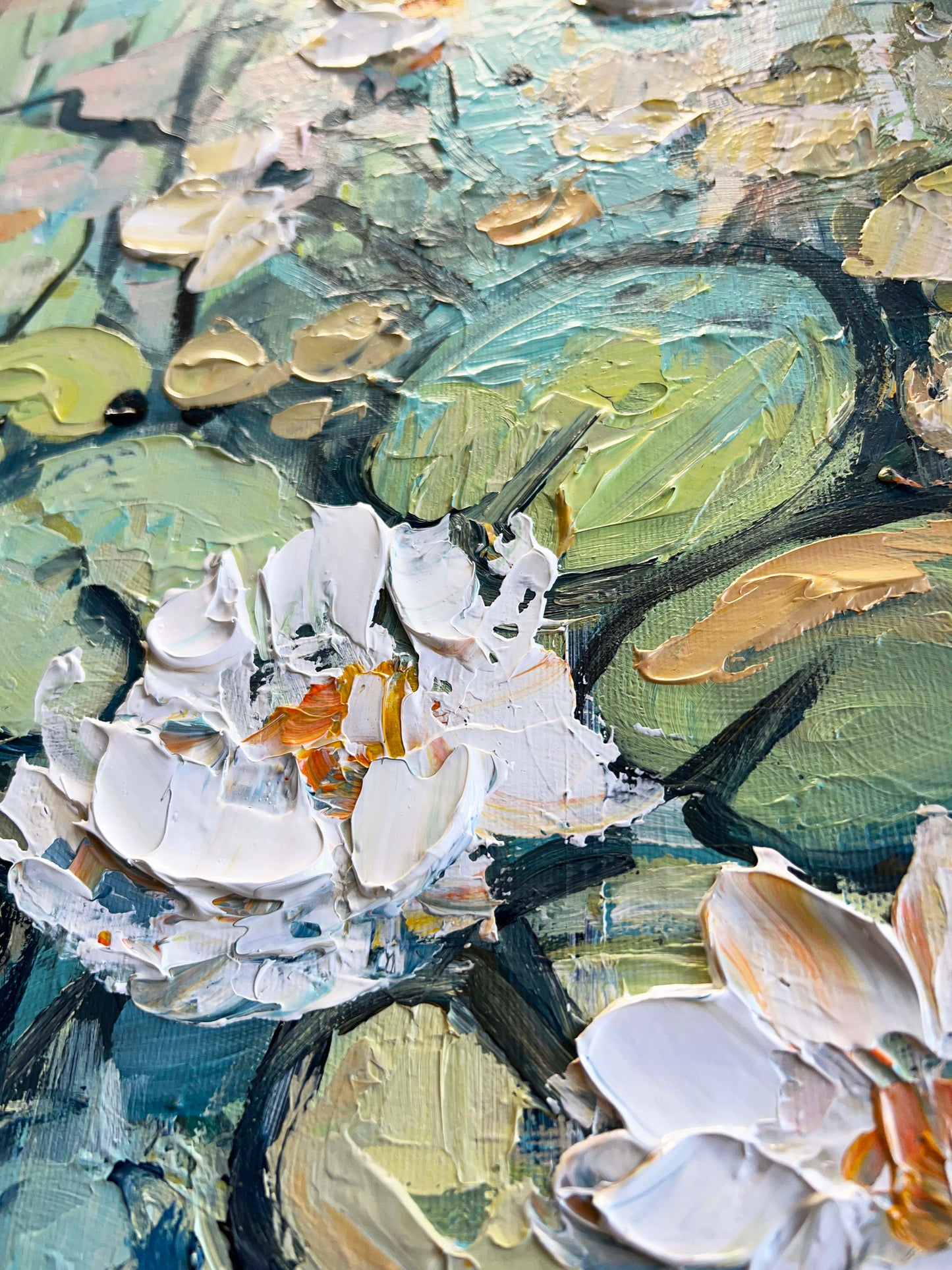 a close up of a painting of water lilies