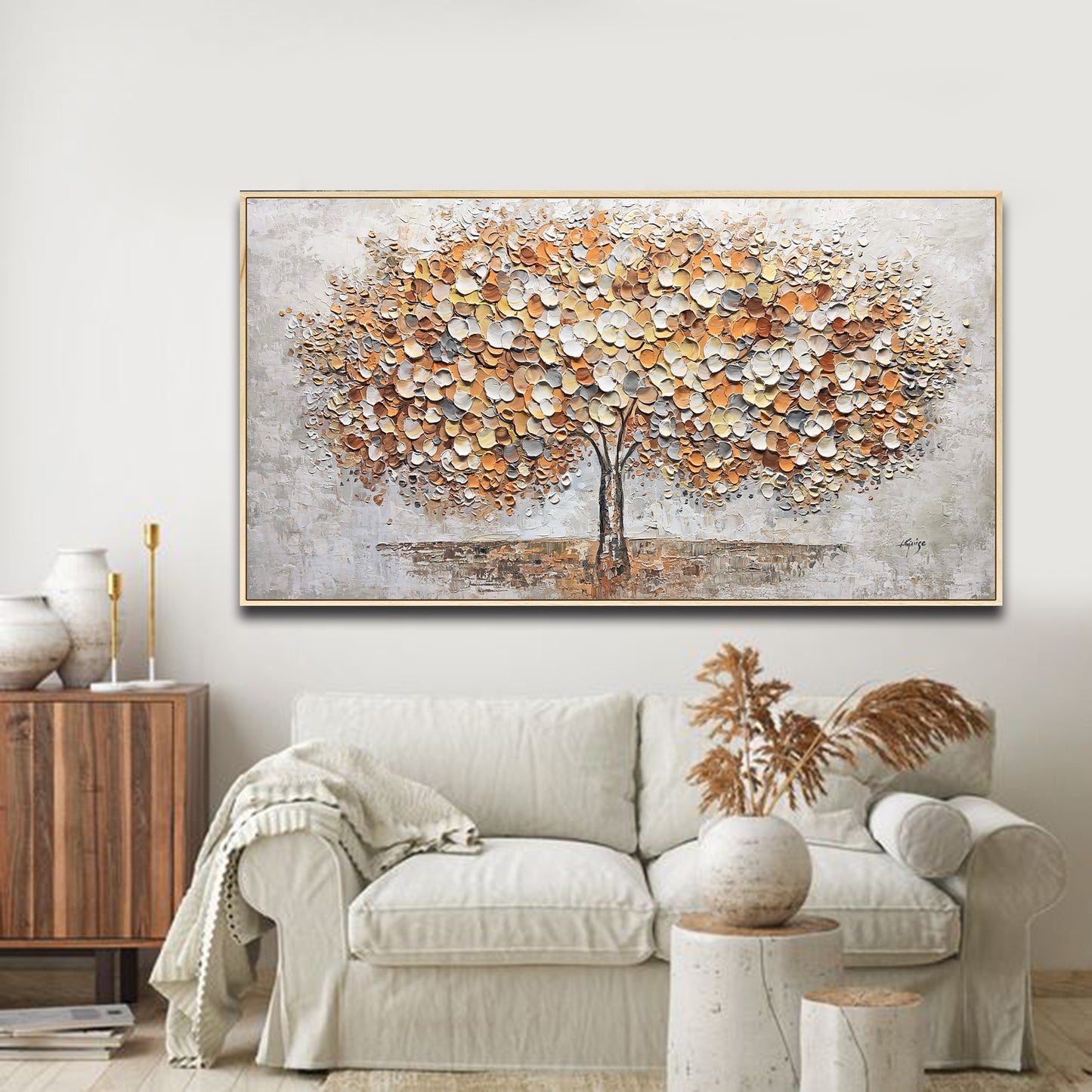 a living room with a couch and a painting on the wall