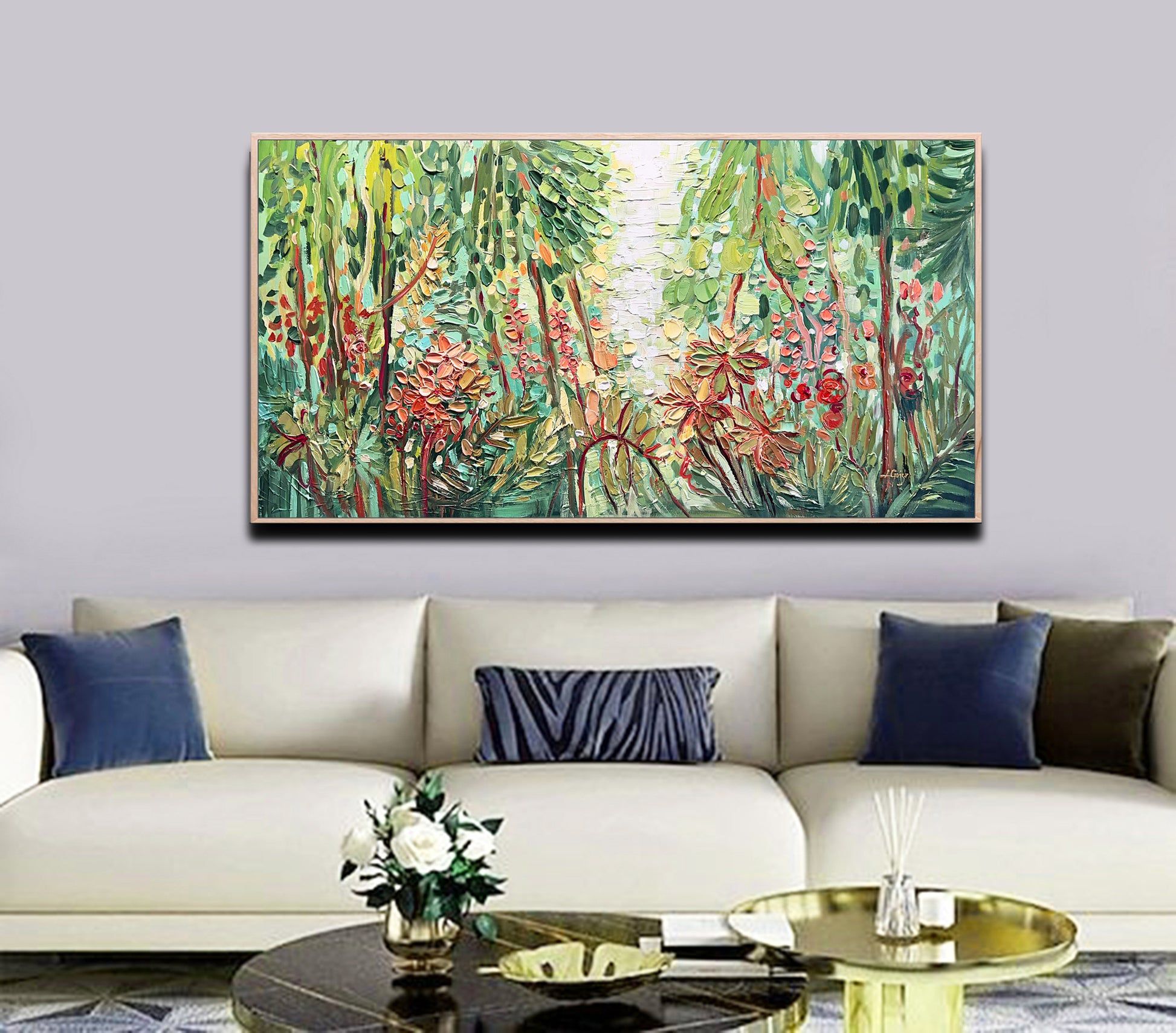 a living room with a couch and a painting on the wall