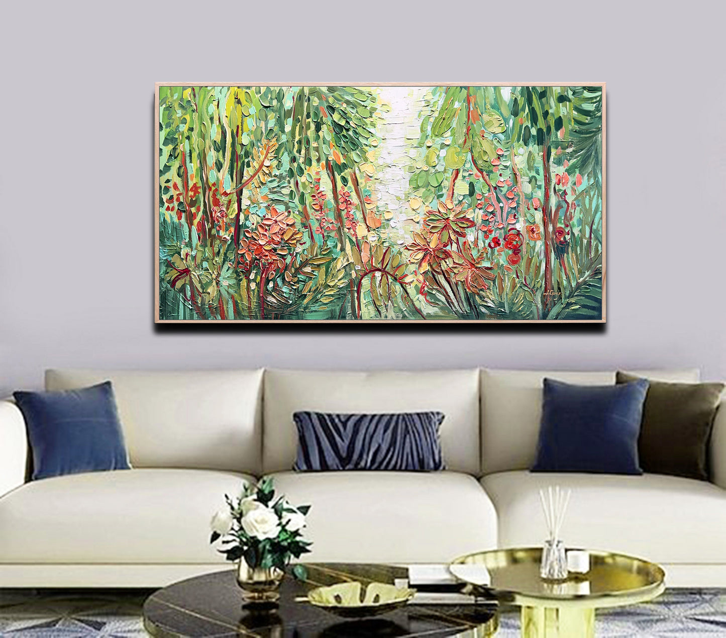 a living room with a couch and a painting on the wall