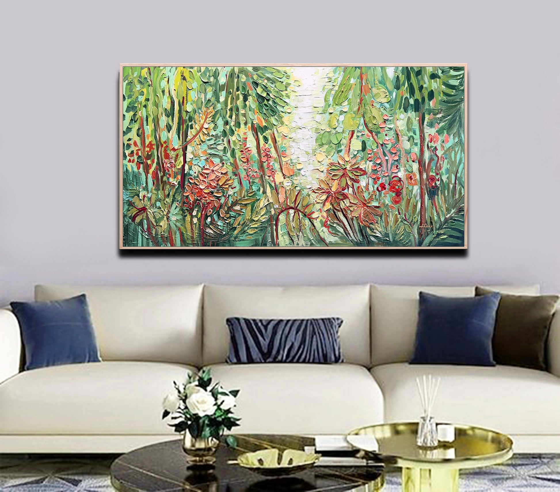 a living room with a couch and a painting on the wall