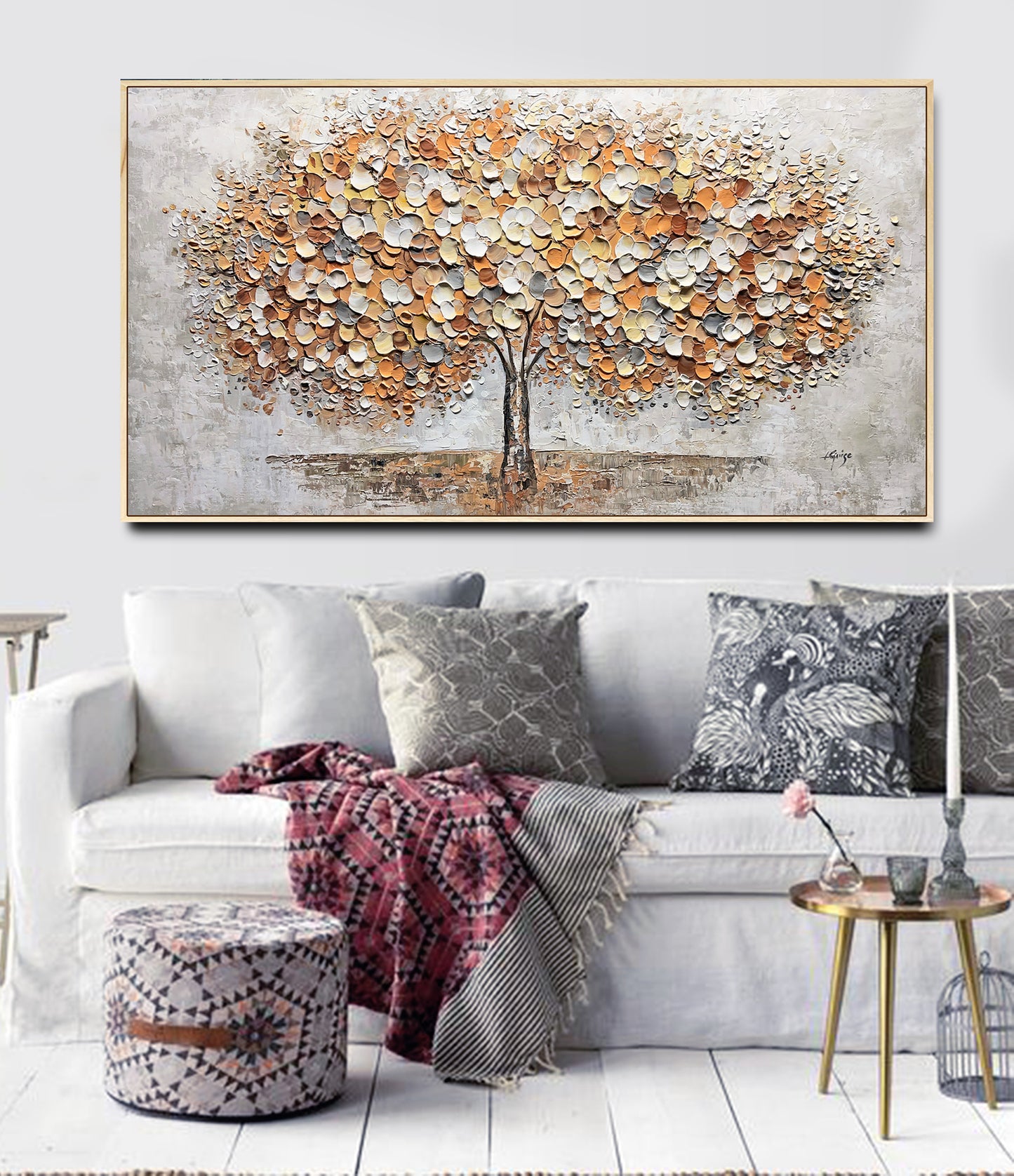 a living room with a couch and a painting on the wall