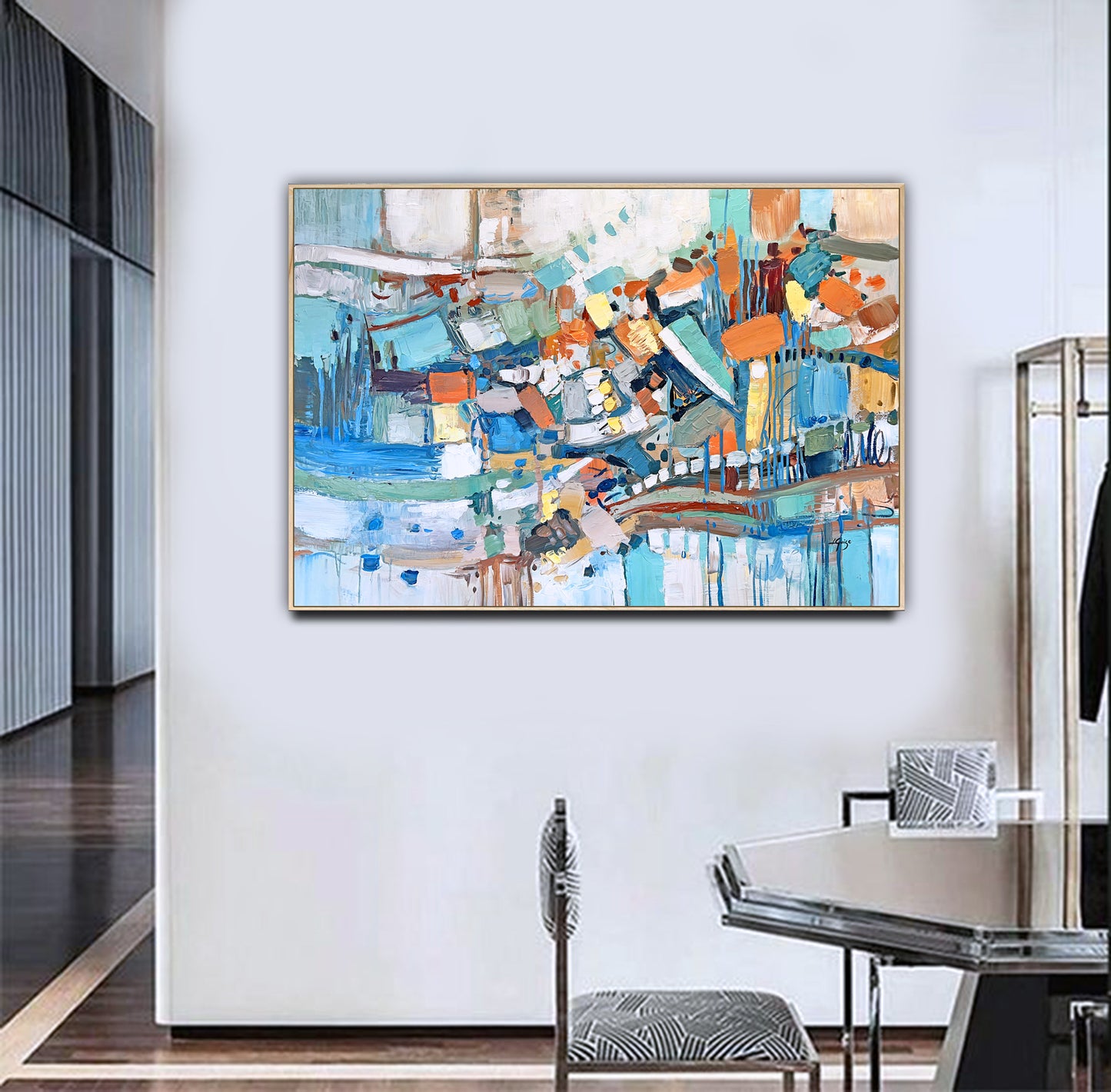 a painting hanging on a wall in a room