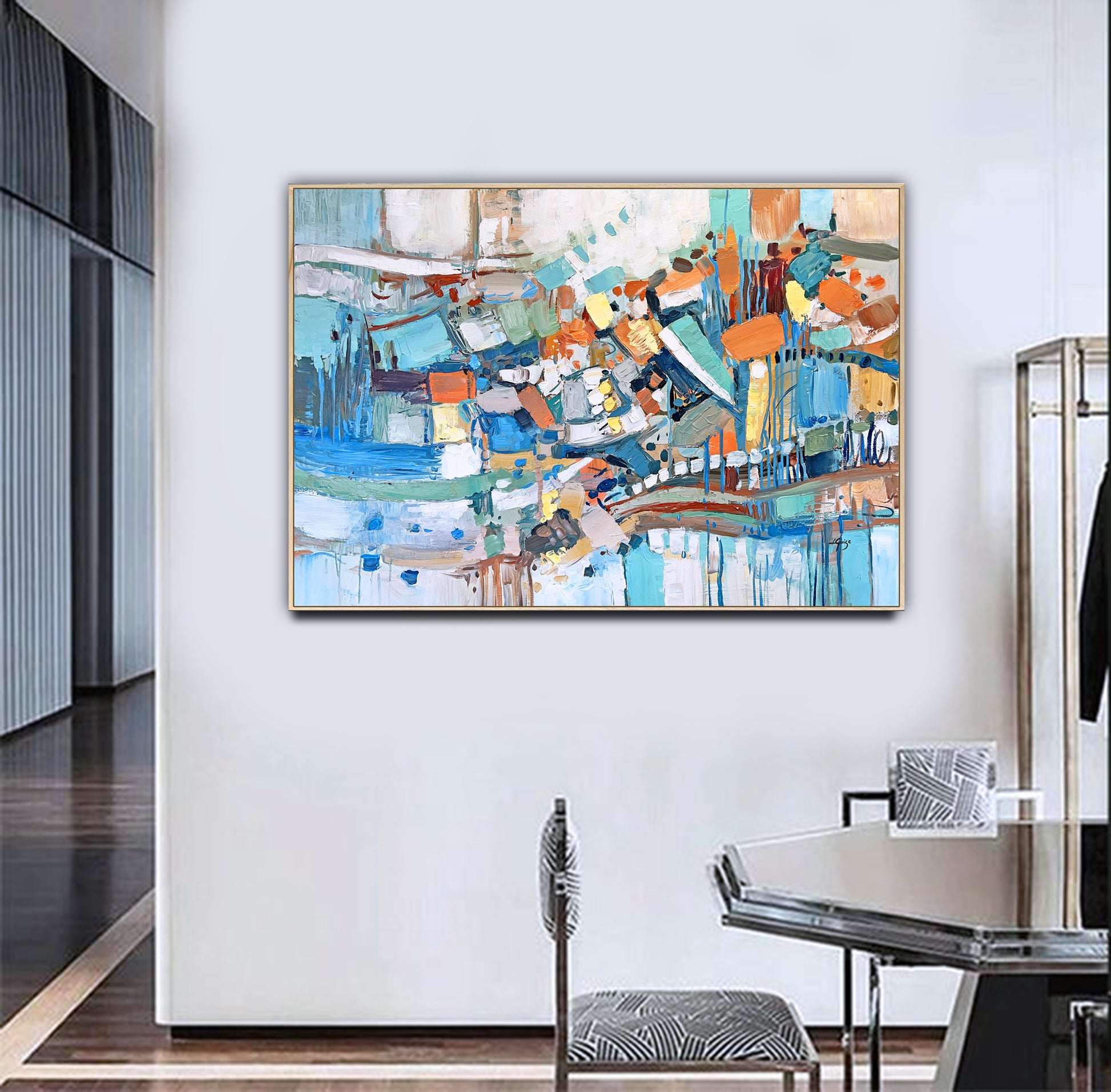 a painting hanging on a wall in a room