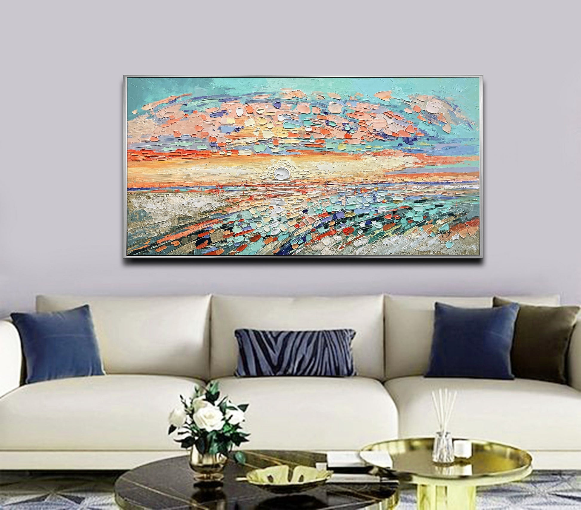 a living room with a couch and a painting on the wall