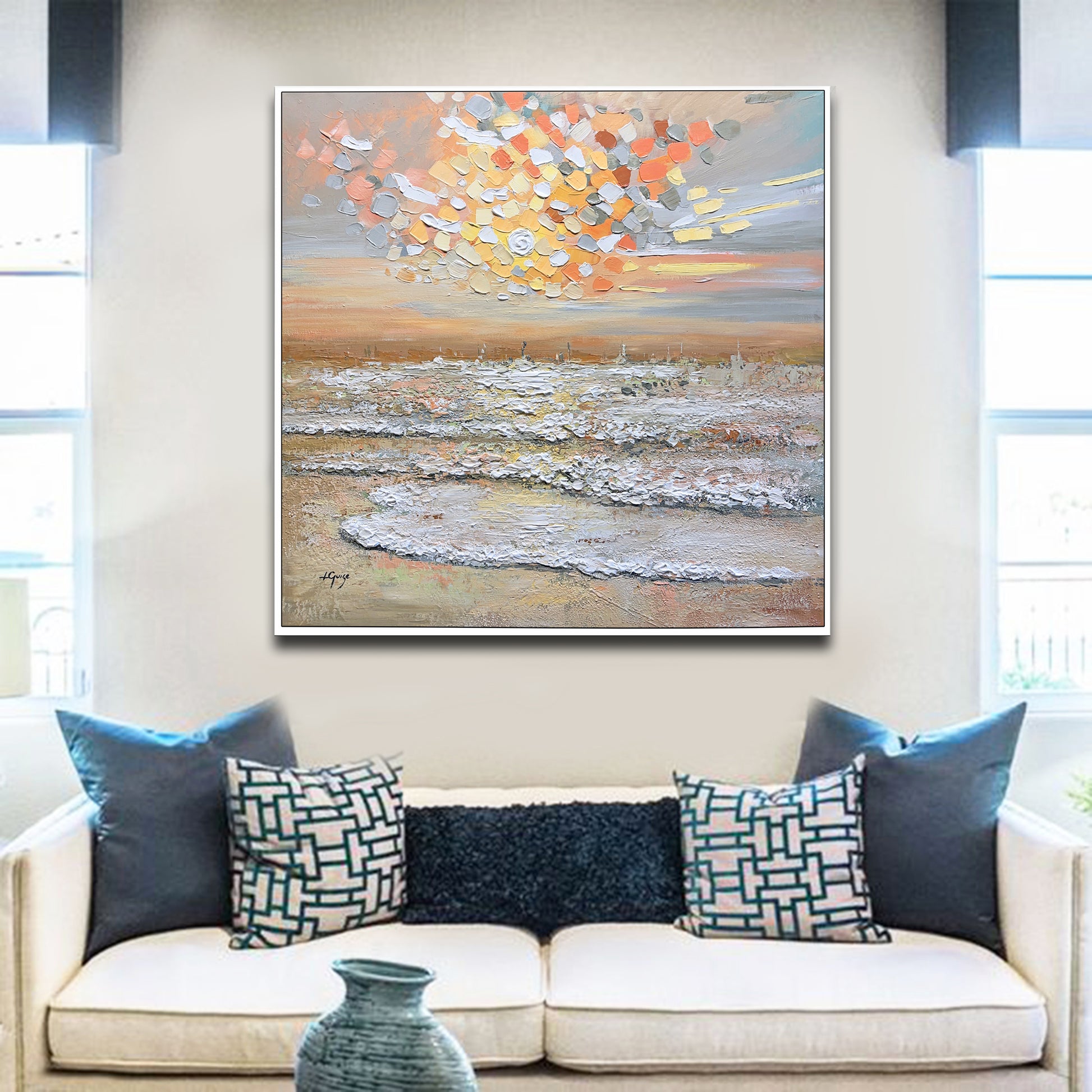 a living room with a couch and a painting on the wall