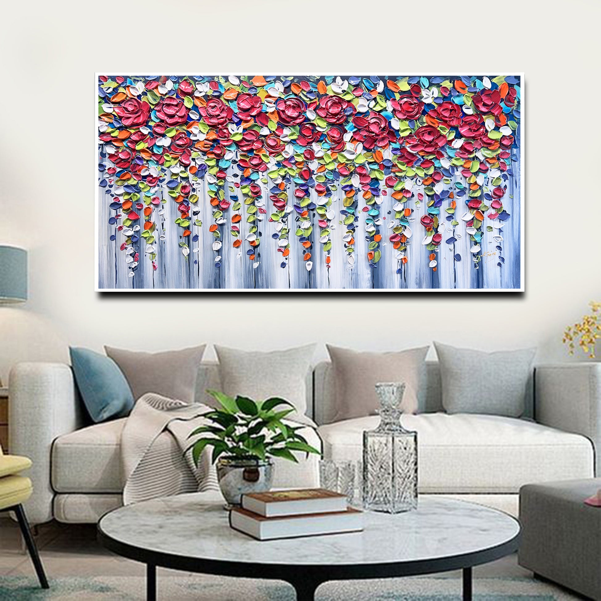 a living room filled with furniture and a painting on the wall