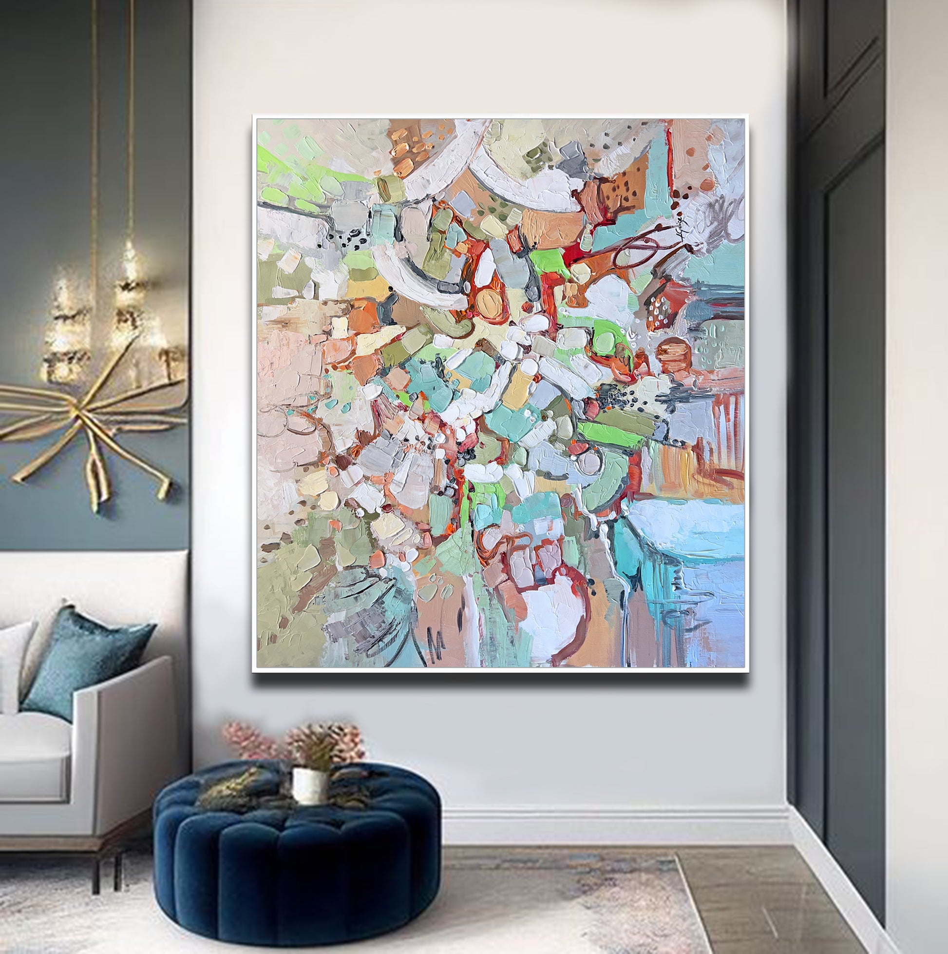 a living room with a couch and a painting on the wall