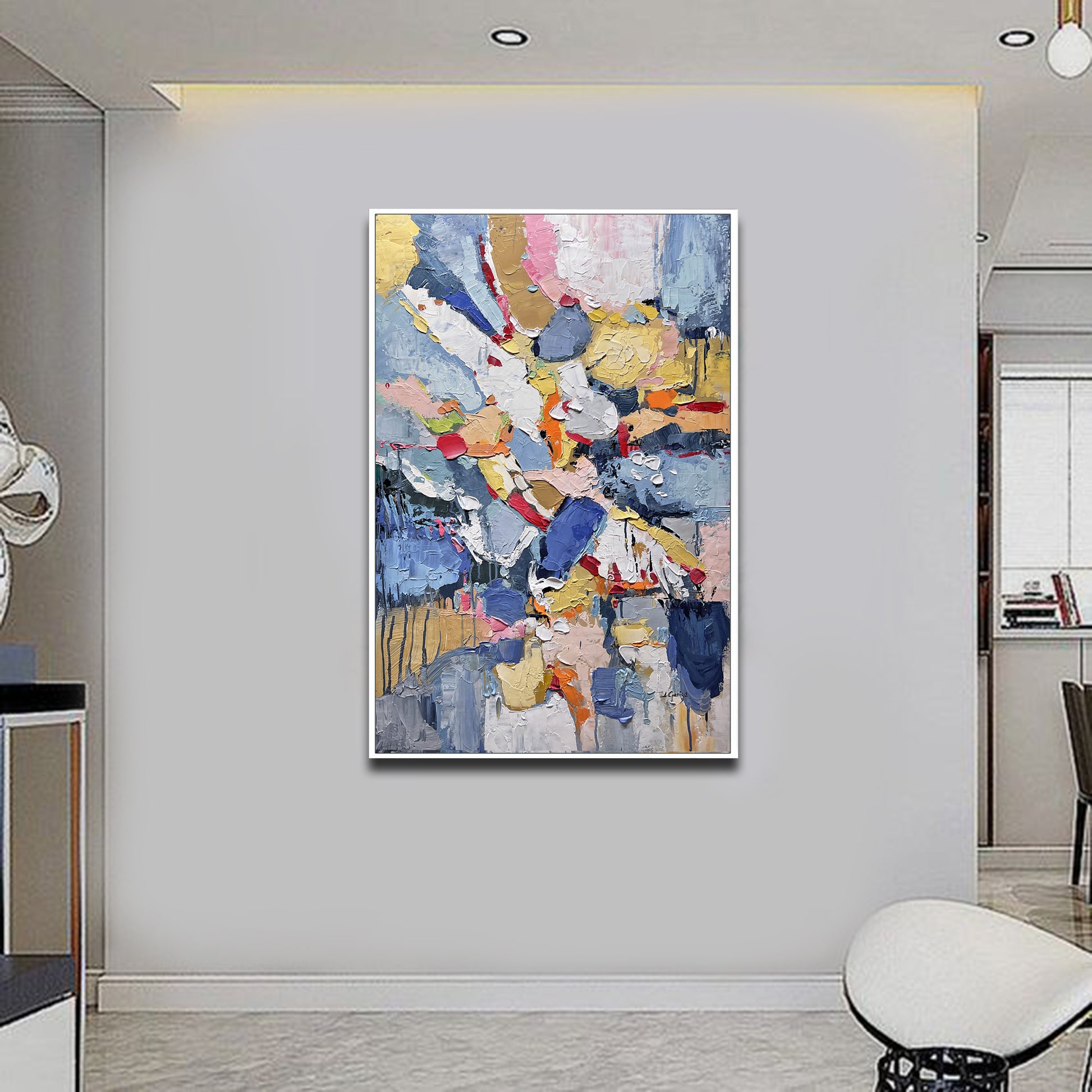 a living room with a painting on the wall