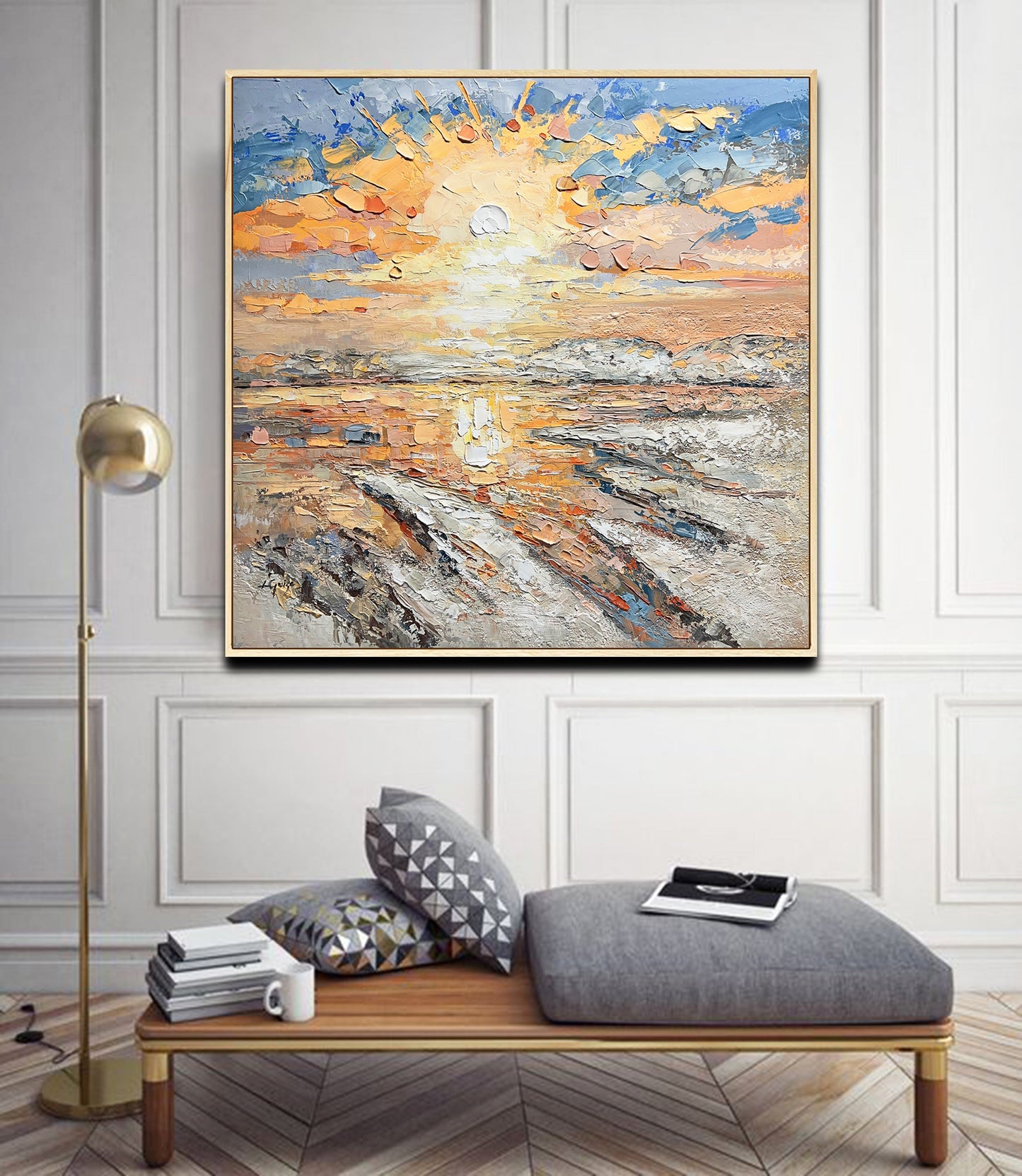 a living room with a couch and a painting on the wall