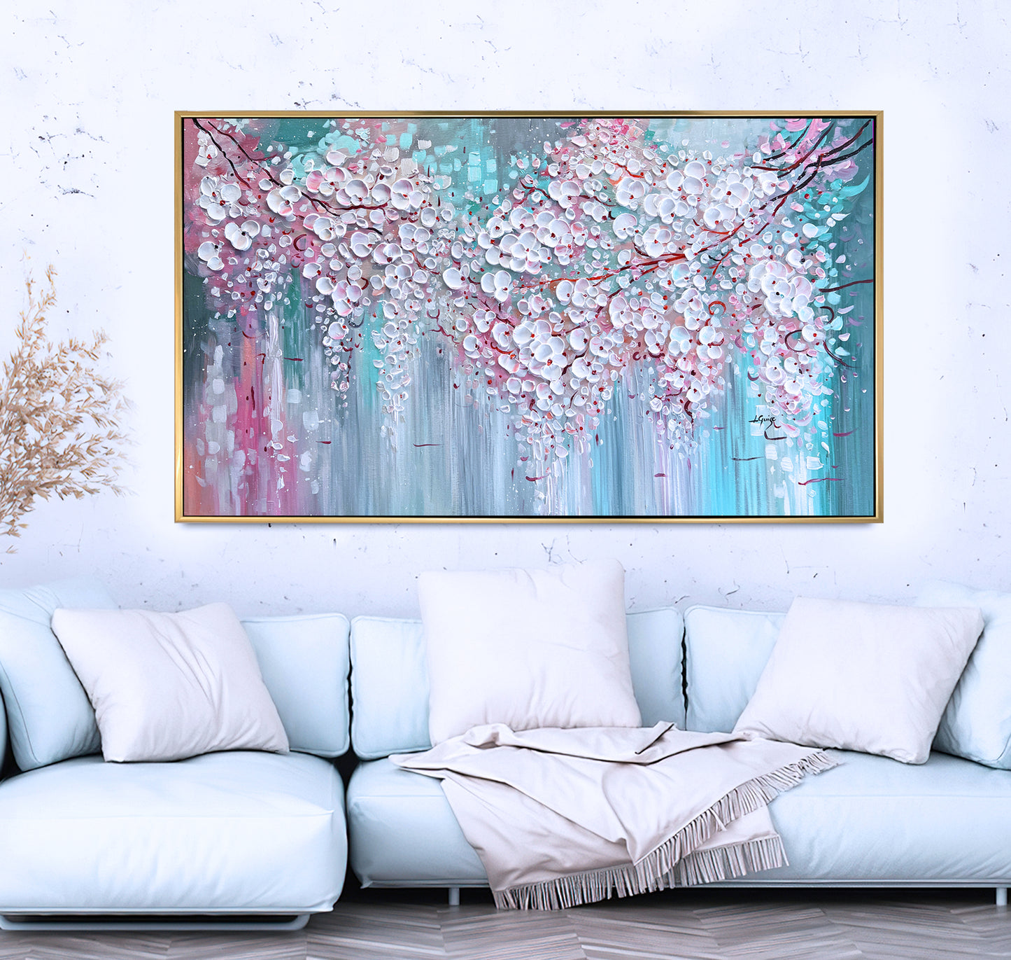 a living room with a couch and a painting on the wall