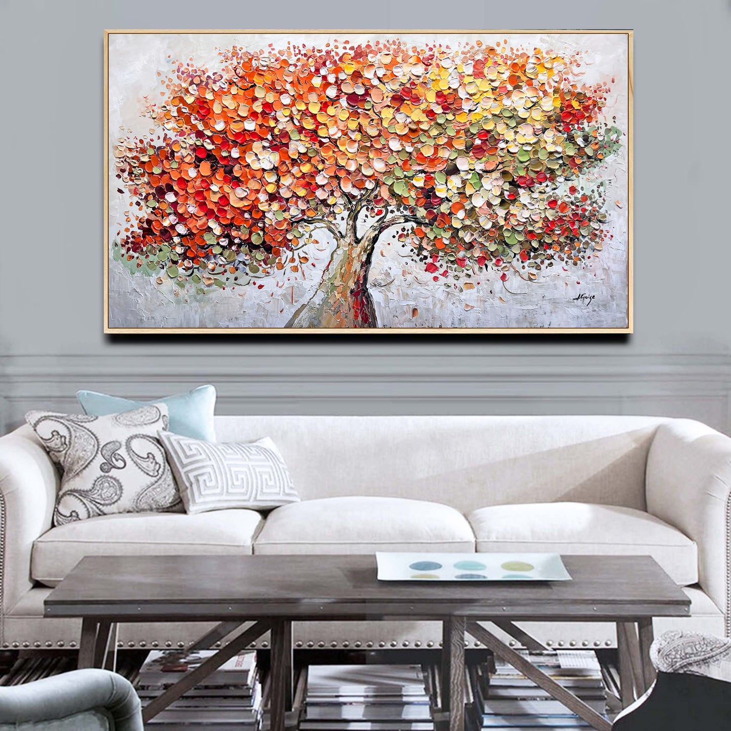 a living room with a couch and a painting on the wall