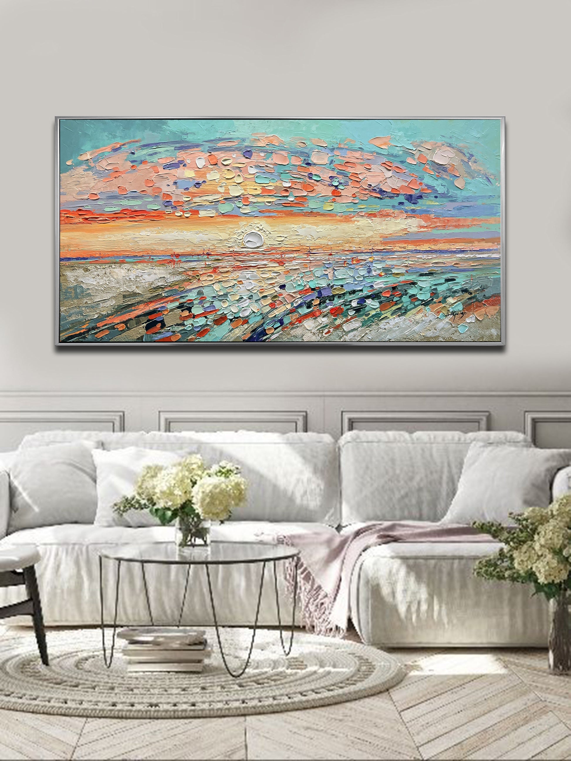 a living room with a large painting on the wall