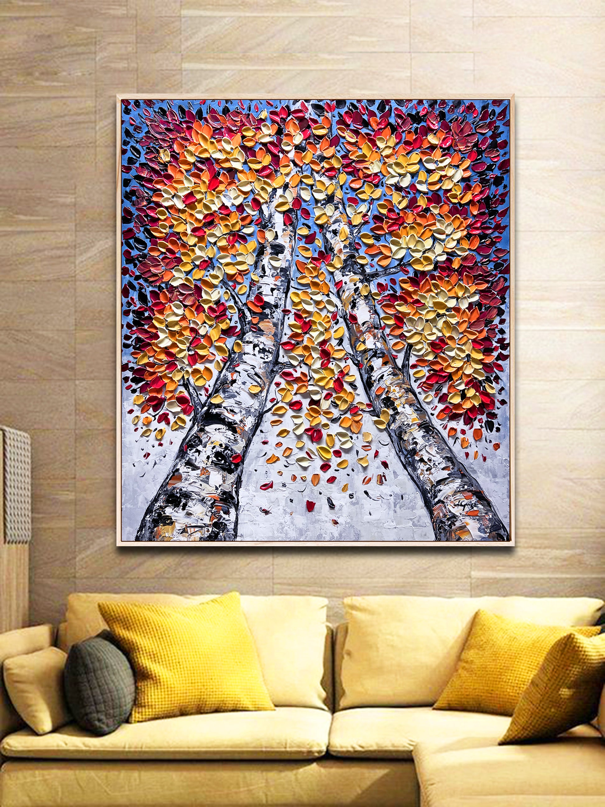 a living room with a couch and a painting on the wall