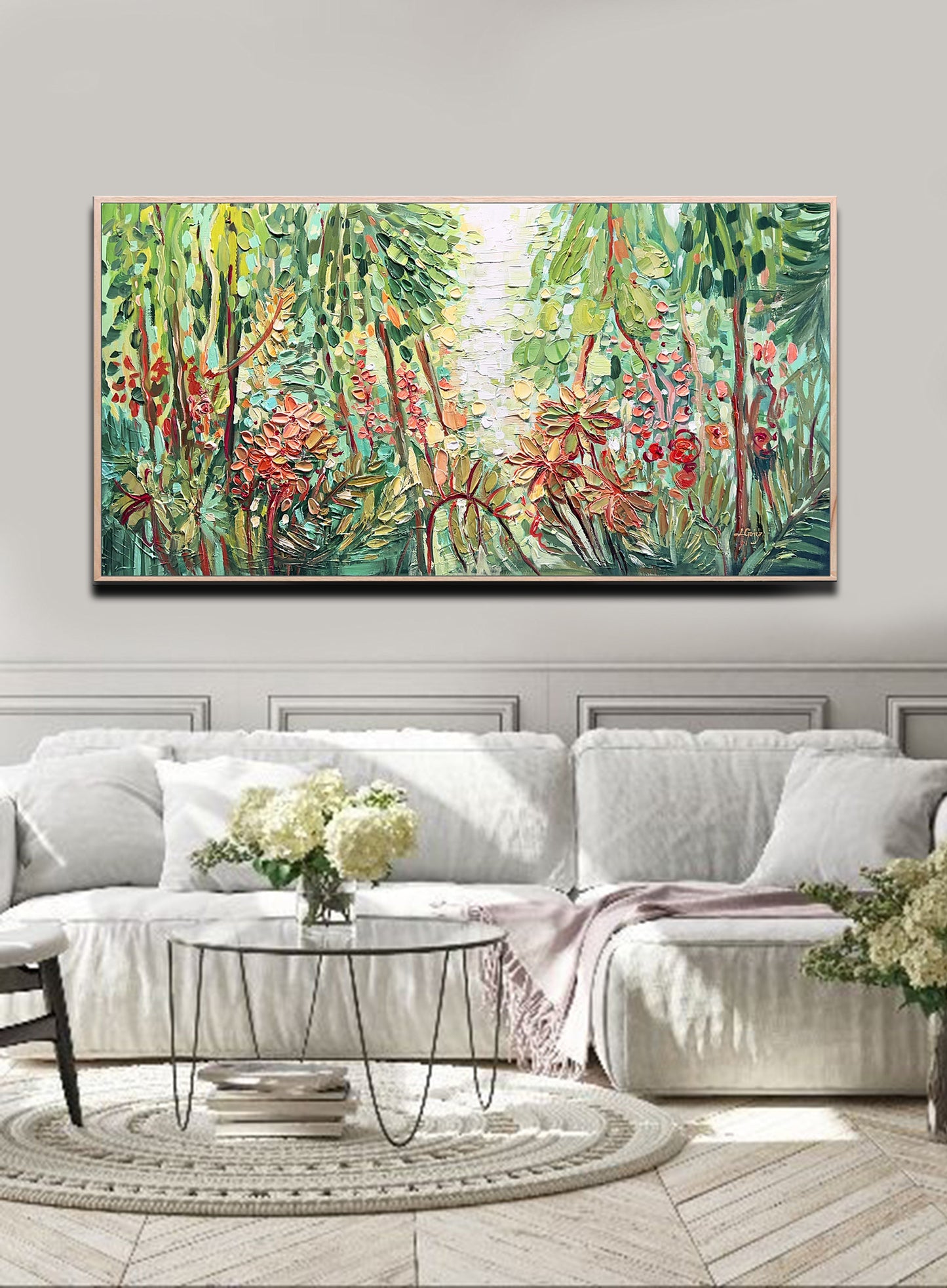 a living room with a large painting on the wall