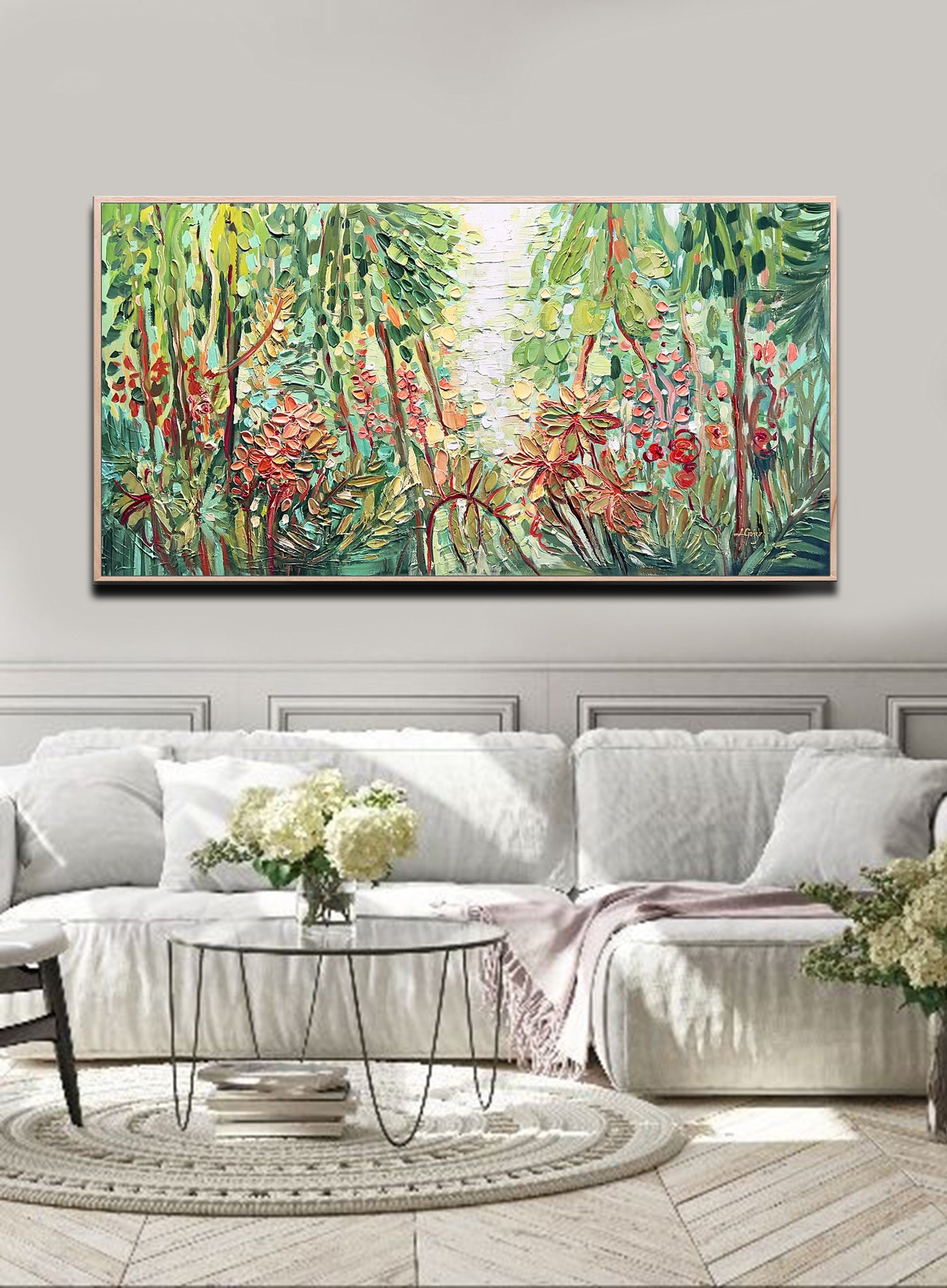 a living room with a large painting on the wall