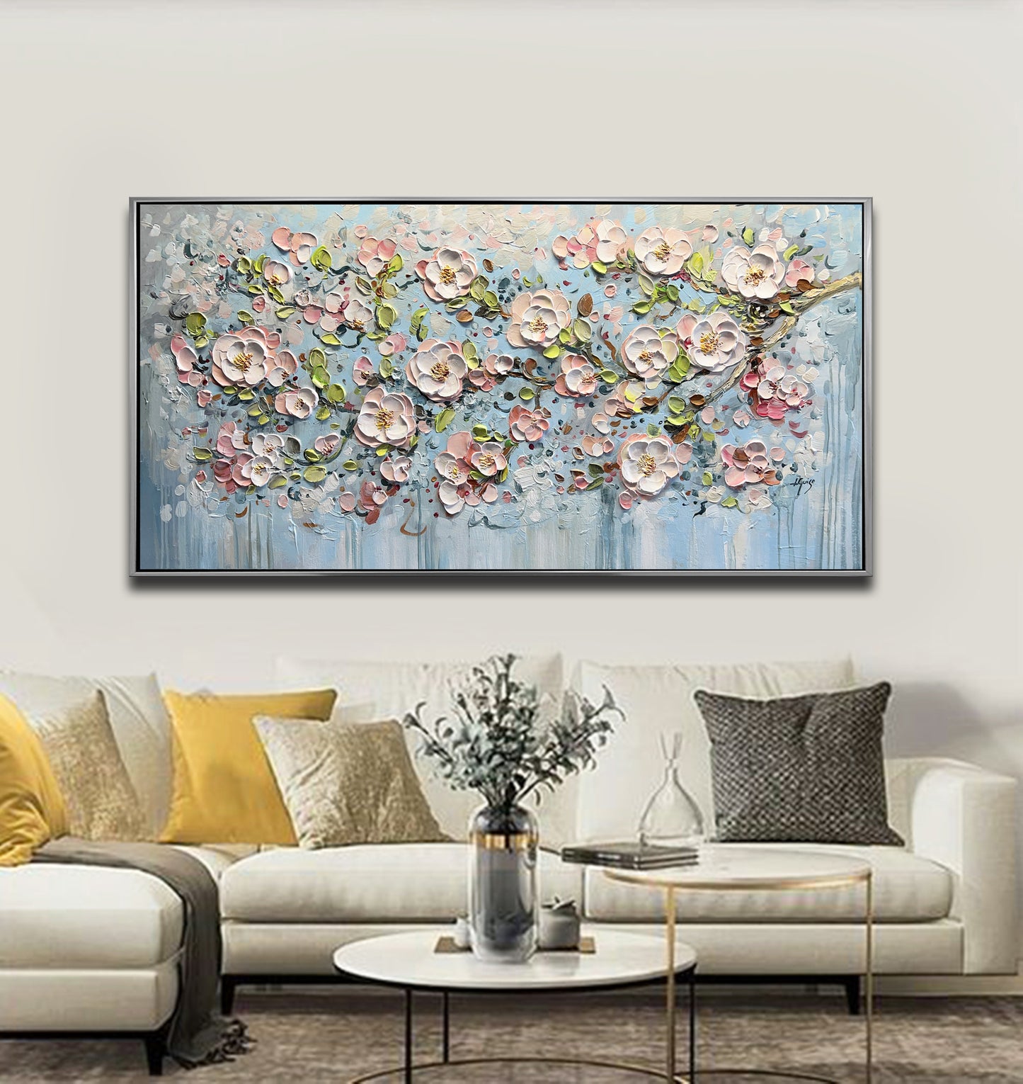 a living room with a couch and a painting on the wall