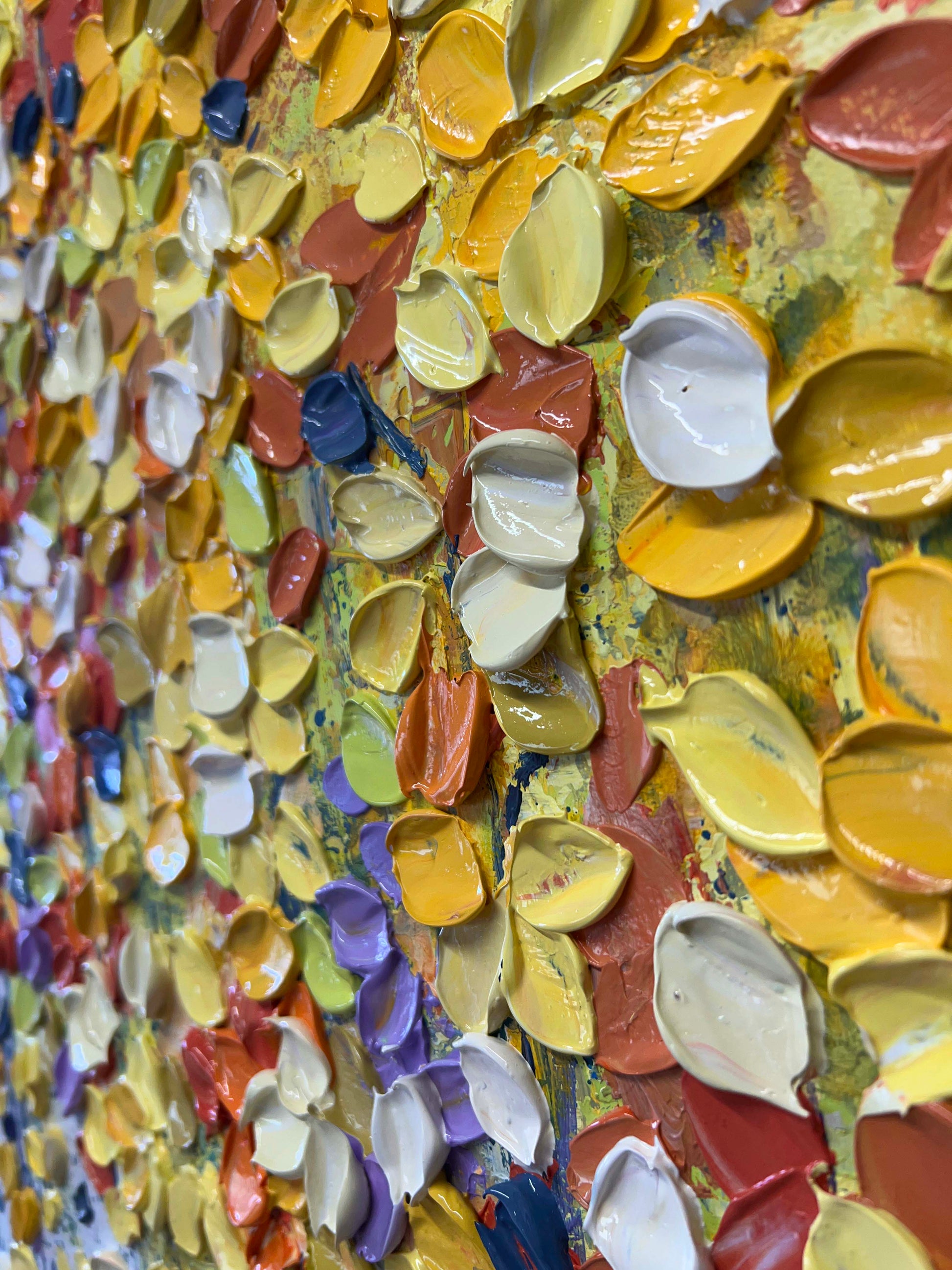 a close up of a wall with many different colors of paint
